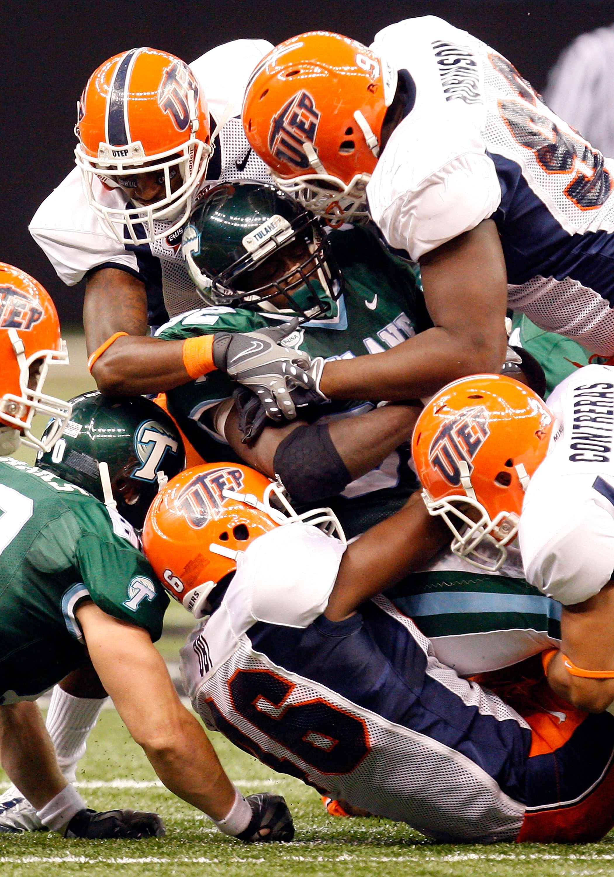 NEW ORLEANS - NOVEMBER 07: Running back Andre Anderson #32 of the Tulane Green Wave is tackled by the UTEP Miners at Louisana Superdome on November 7, 2009 in New Orleans, Louisiana. (Photo by Ronald Martinez/Getty Images)