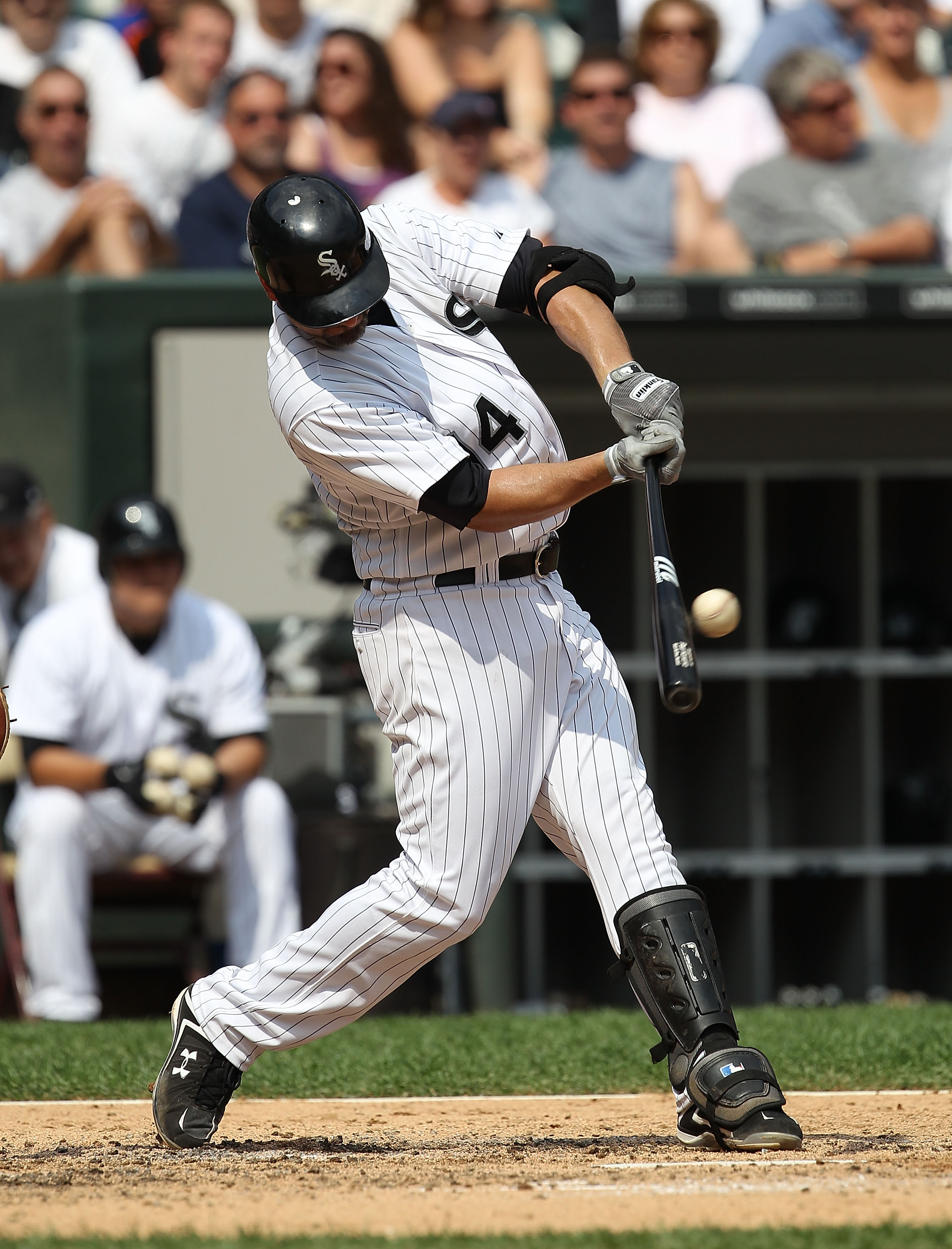 CHICAGO - AUGUST 29: Paul Konerko #14 of the Chicago White Sox hits the ball against the New York Yankees at U.S. Cellular Field on August 29, 2010 in Chicago, Illinois. The Yankees defeated the White Sox 2-1. (Photo by Jonathan Daniel/Getty Images)