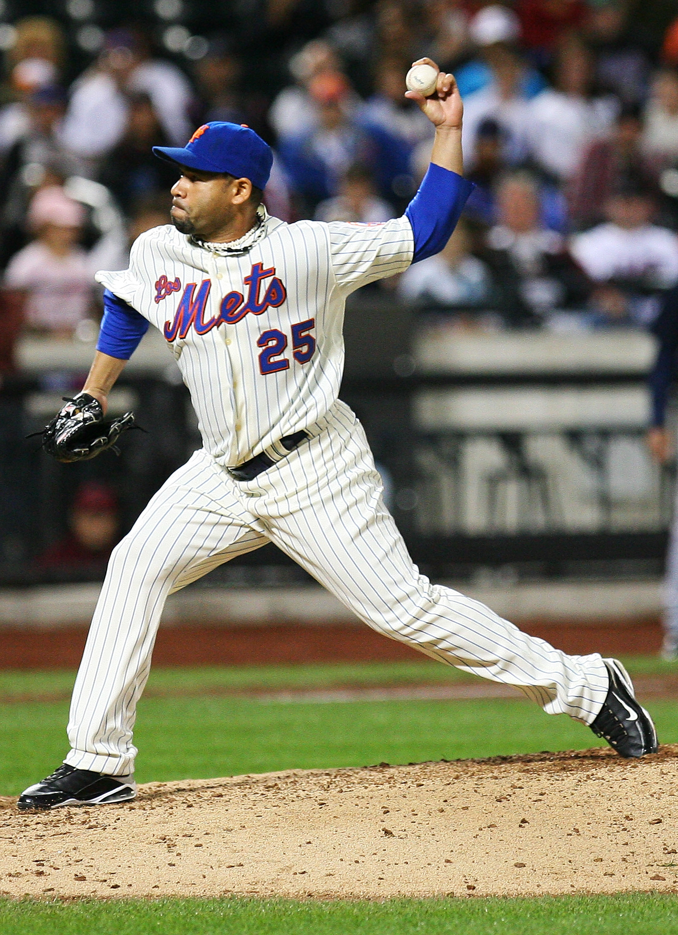 NEW YORK - SEPTEMBER 17:  Pedro Feliciano #25 of the New York Mets pitches against the Atlanta Braves on September 17, 2010 at Citi Field in the Flushing neighborhood of the Queens borough of New York City. The Braves beat the Mets 6 - 4.  (Photo by Andre