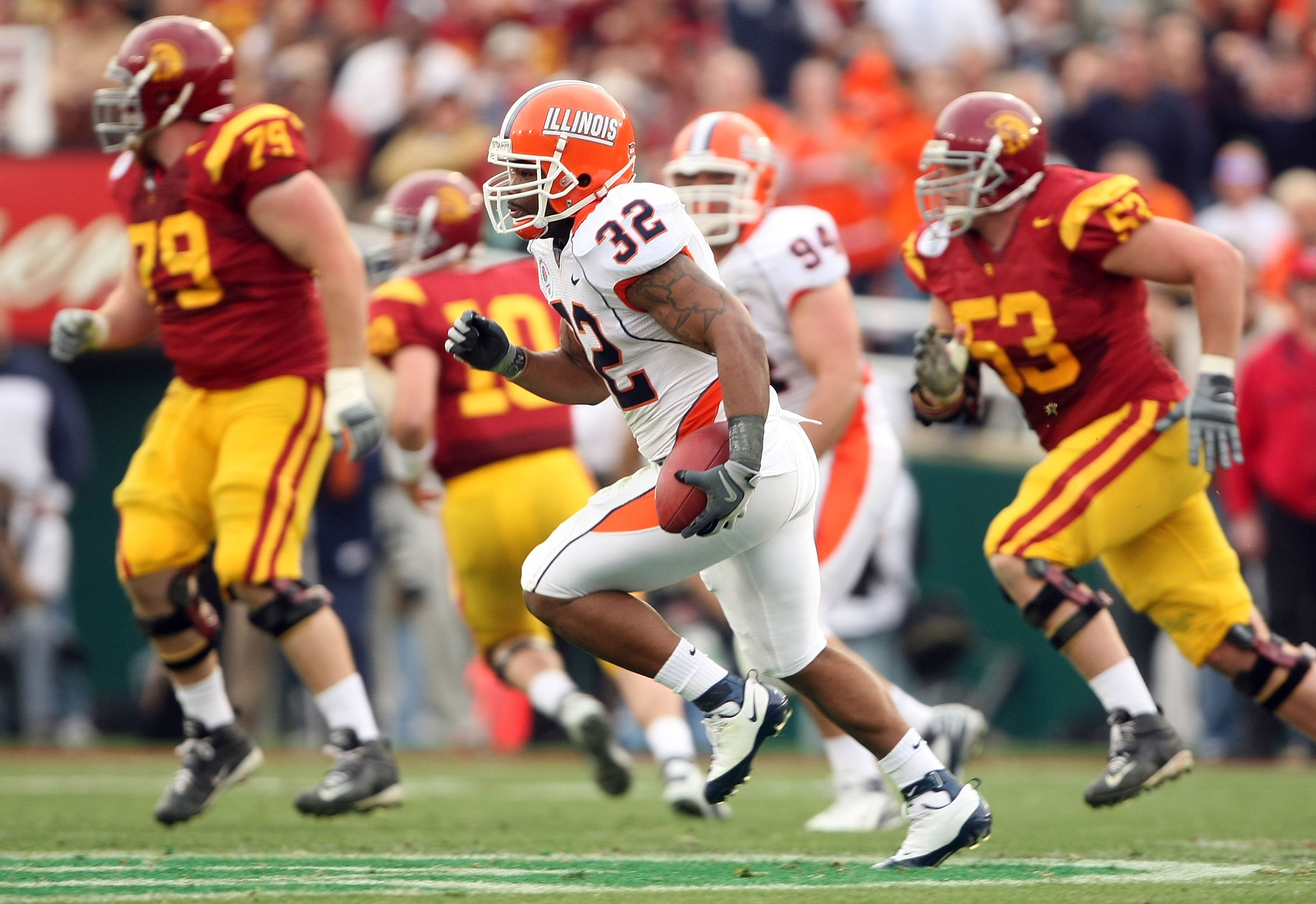 PASADENA, CA - JANUARY 01: Defensive back Justin Harrison #32 of the Illinois Fighting Illini runs the ball back on an interception in the first quarter against the USC Trojans during the Rose Bowl presented by Citi at the Rose Bowl on January 1, 2008 in