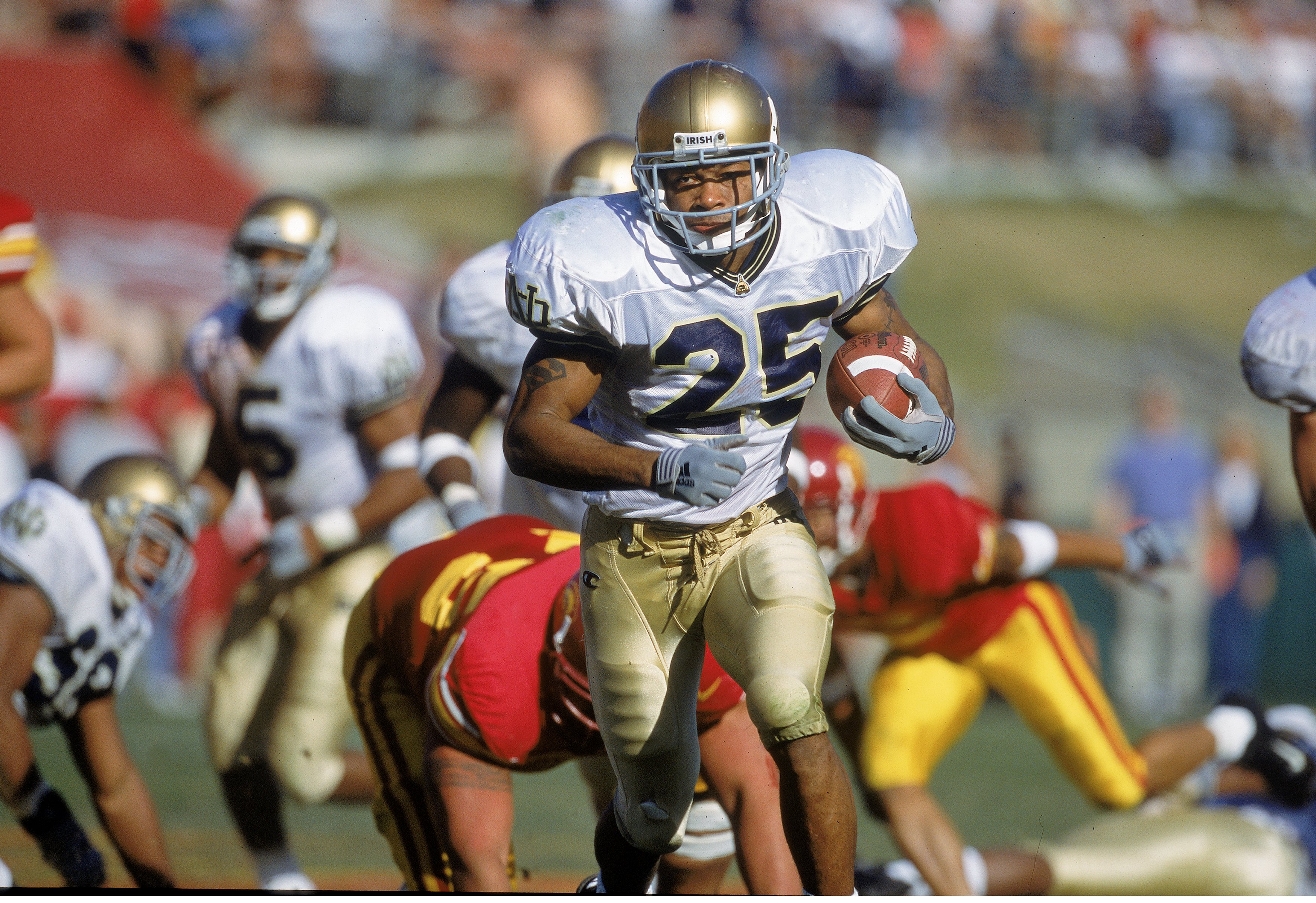 25 Nov 2000: Tony Driver #25 of the Notre Dame Fighting Irish carries the ball during the game against the USC Trojans at the Los Angeles Coliseum in Los Angeles, California. The Fighting Irish defeated the Trojans 38-21.Mandatory Credit: Jon Ferrey /Al