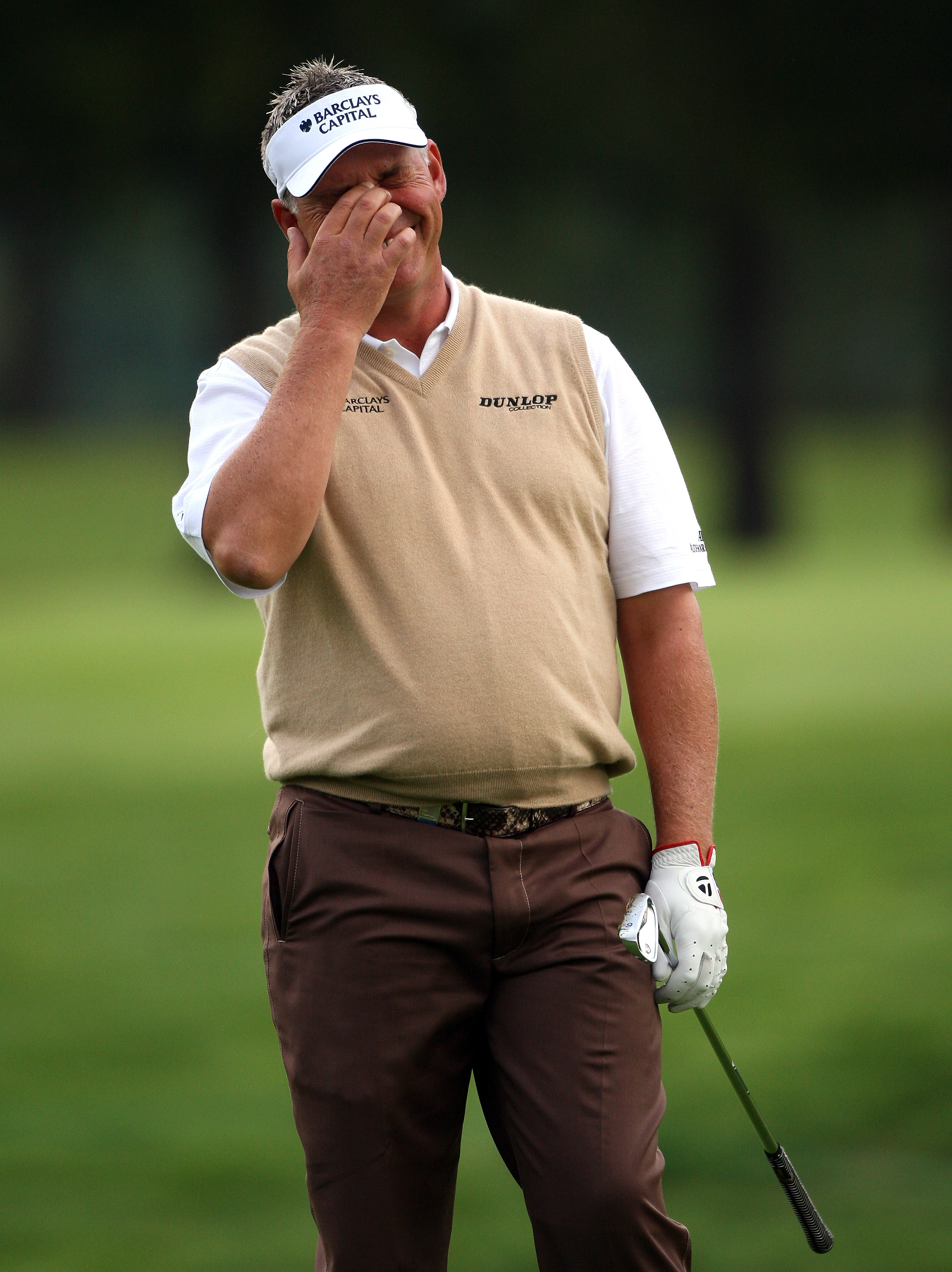 CRANS, SWITZERLAND - SEPTEMBER 03:  Darren Clarke of Northern Ireland shows his frustration after his second shot on the 12th hole during the first round of The Omega European Masters at Crans-Sur-Sierre Golf Club on September 3, 2009 in Crans Montana, Sw