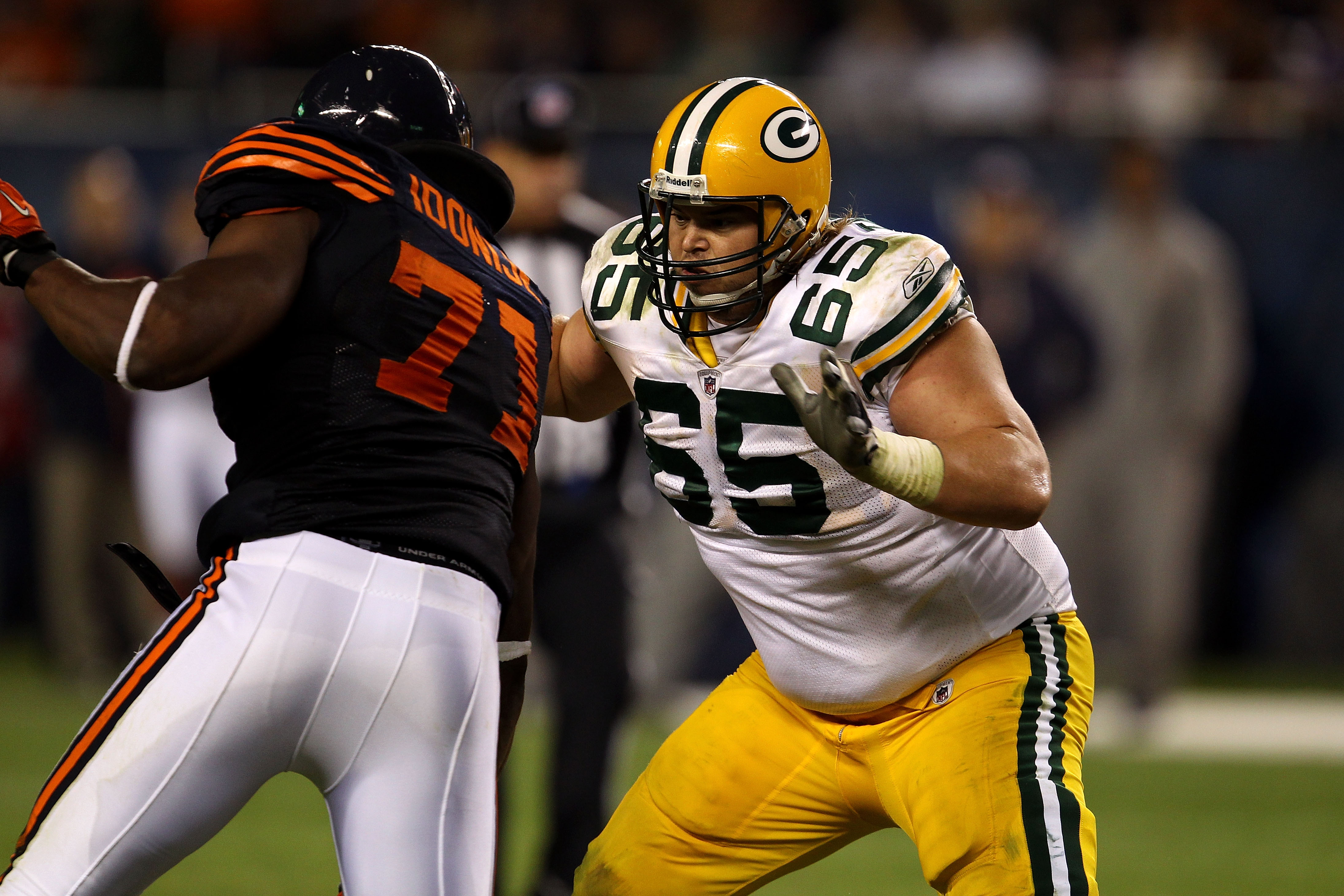 CHICAGO - SEPTEMBER 27:  Offensive guard Mark Tauscher #65 of the Green Bay Packers blocks against the Chicago Bears at Soldier Field on September 27, 2010 in Chicago, Illinois.  (Photo by Jonathan Daniel/Getty Images)