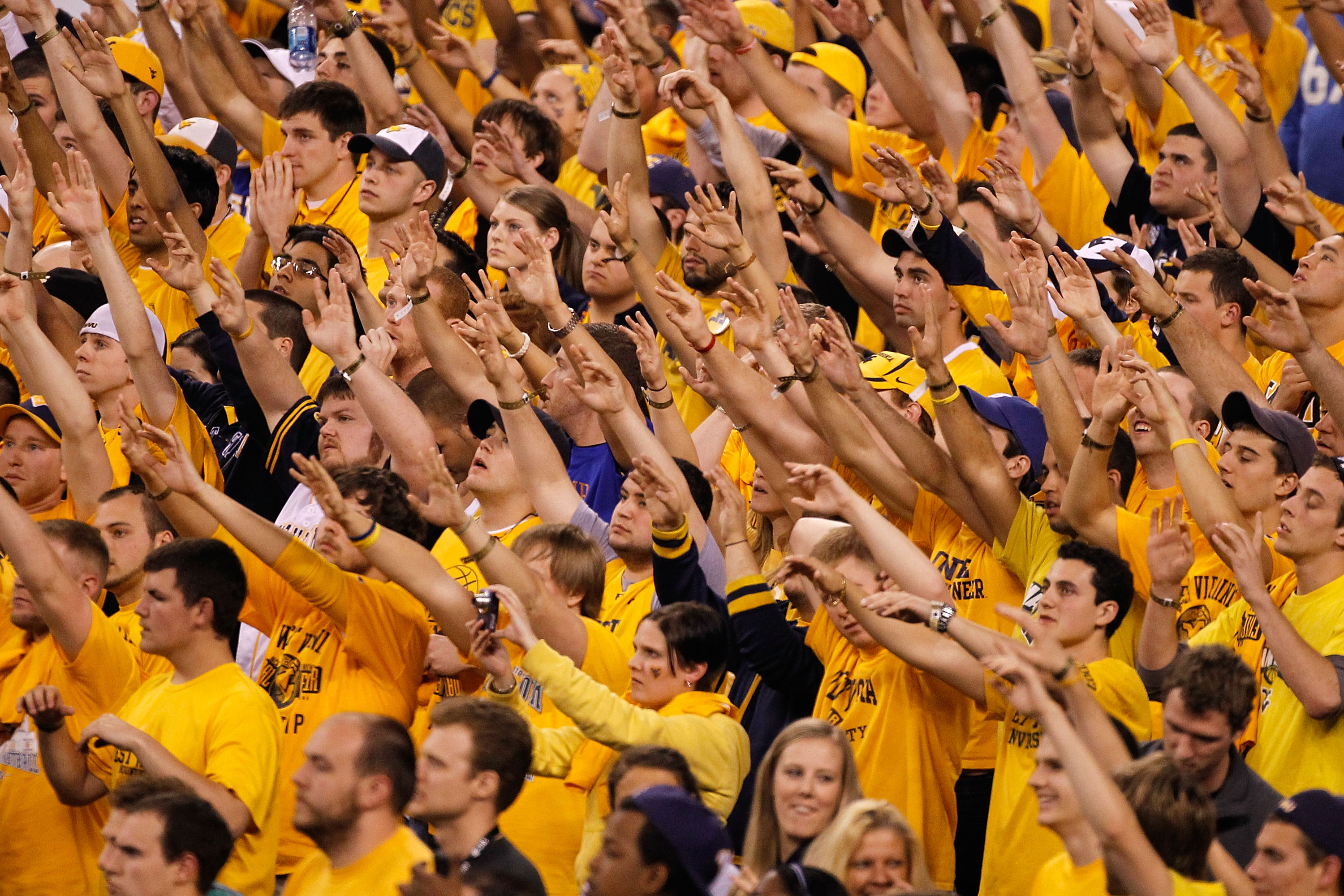 INDIANAPOLIS - APRIL 03: Fans of the West Virginia Mountaineers cheer on their team in the second half against the Duke Blue Devils during the National Semifinal game of the 2010 NCAA Division I Men's Basketball Championship at Lucas Oil Stadium on April