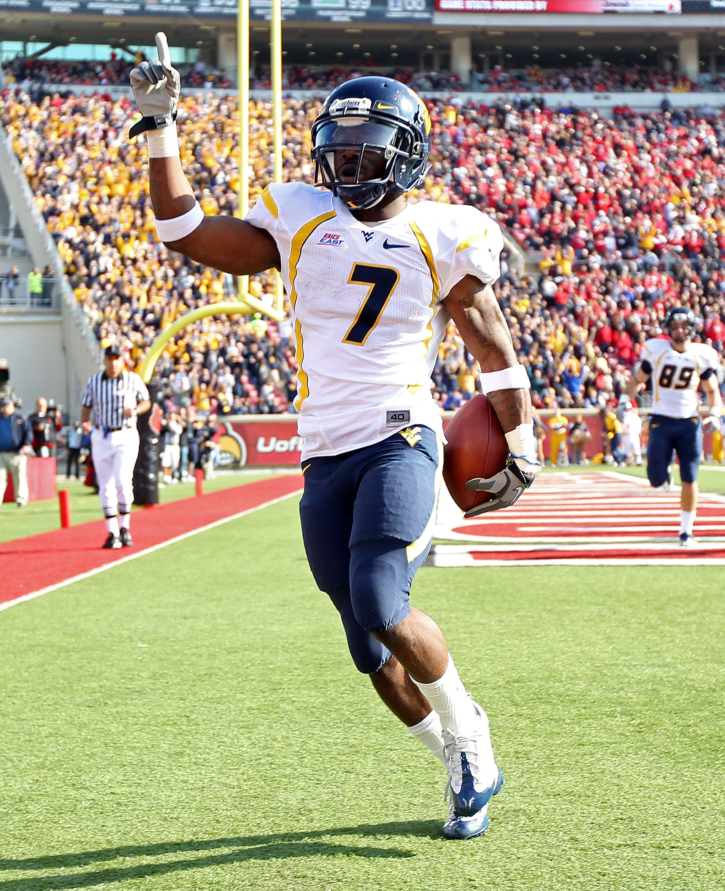 LOUISVILLE, KY - NOVEMBER 20: Noel Devine #7 of the West Virginia Mountaineers celebrates after runing for a touchdown during the Big East Conference game against the Louisville Cardinals at Papa John's Cardinal Stadium on November 20, 2010 in Louisville