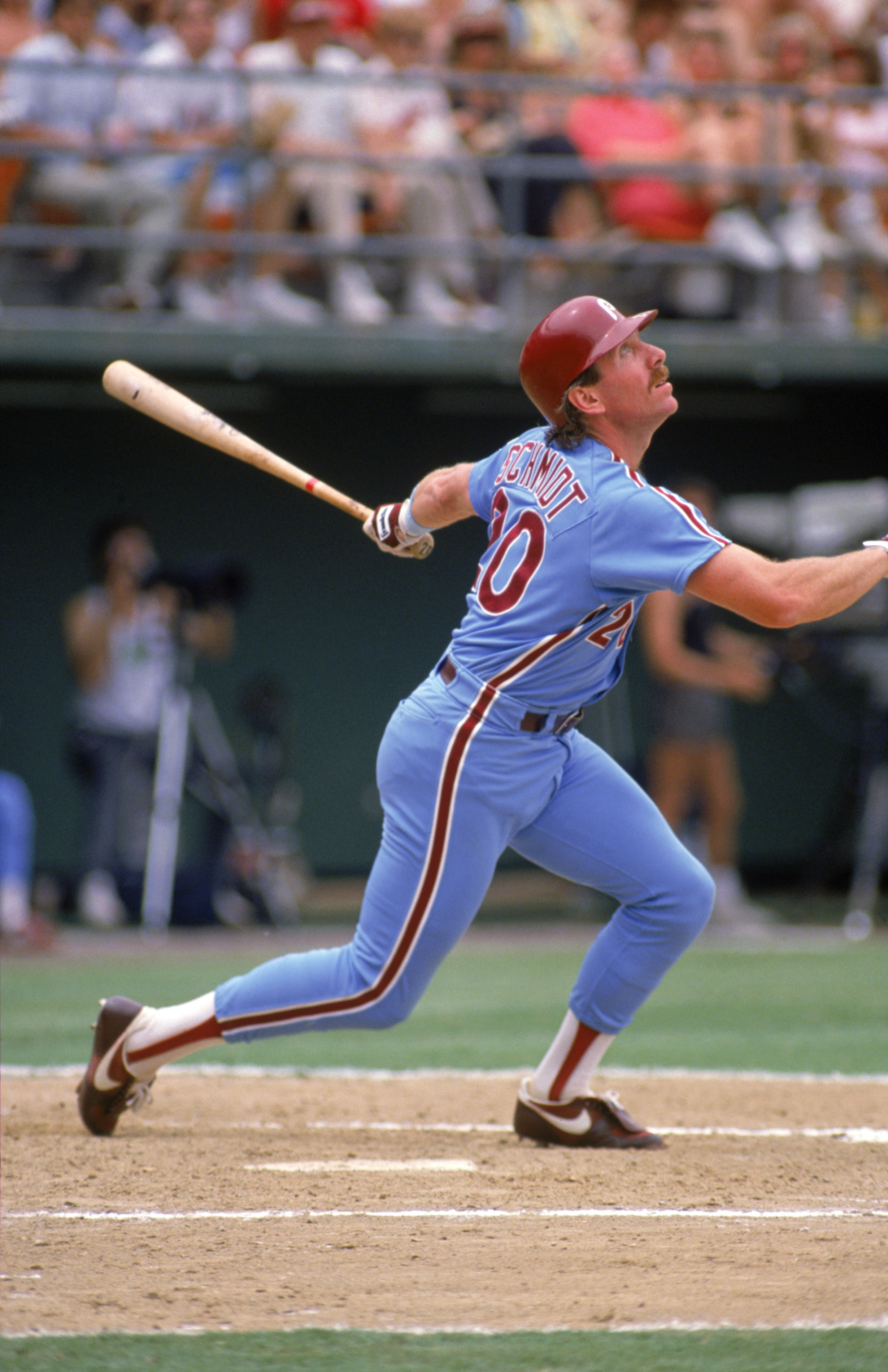 SAN DIEGO - 1987:  Mike Schmidt #20 of the Philadelphia Phillies watches the flight of the ball after a hit during a 1987 season game against the Padres at Jack Murphy Stadium in San Diego, California. (Photo by Stephen Dunn/Getty Images)