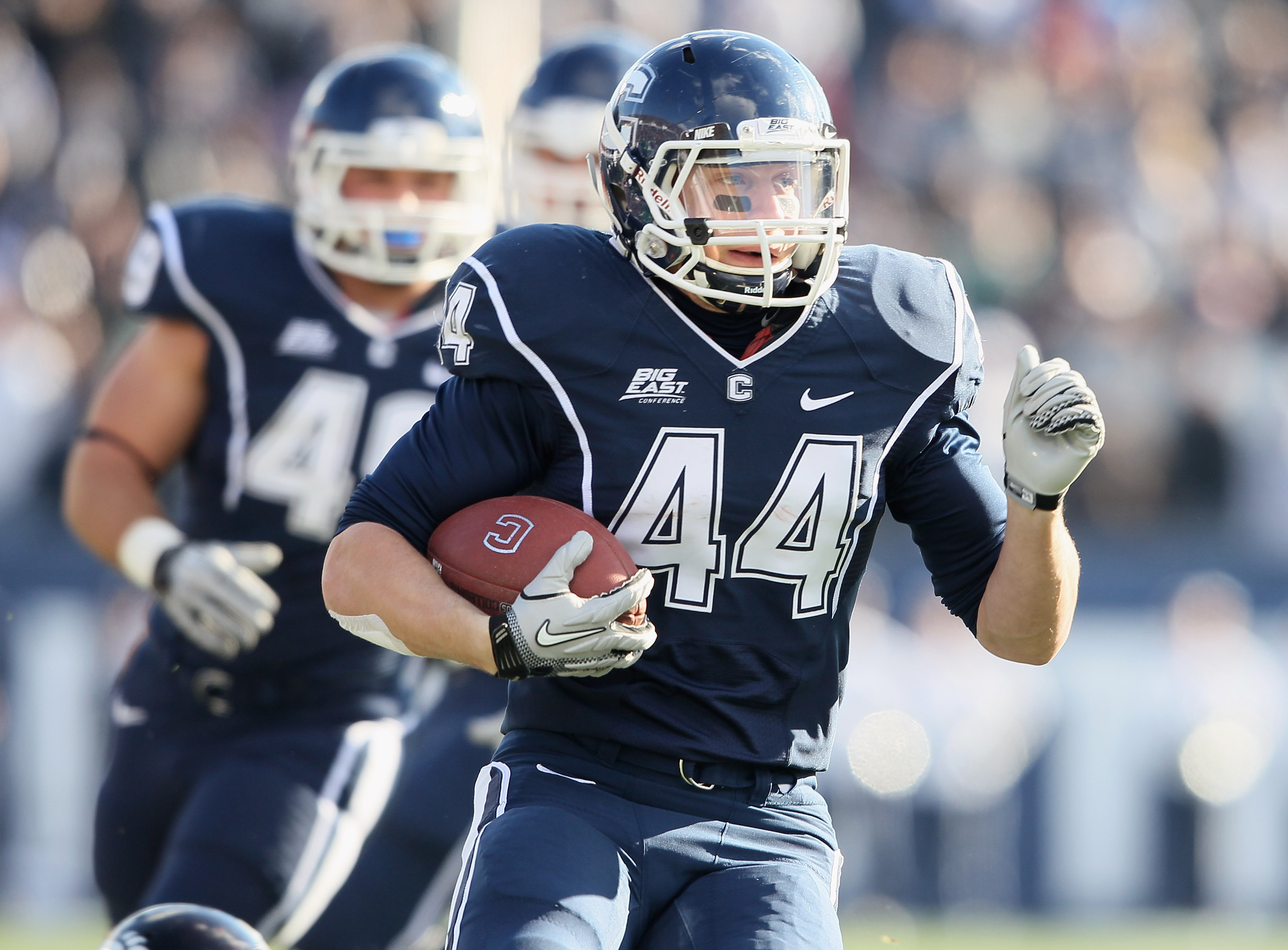 EAST HARTFORD, CT - NOVEMBER 27: Robbie Frey #44 of the Connecticut Huskies carries the ball in the first half against the Cincinnati Bearcats on November 27, 2010 at Rentschler Field in East Hartford, Connecticut. (Photo by Elsa/Getty Images)