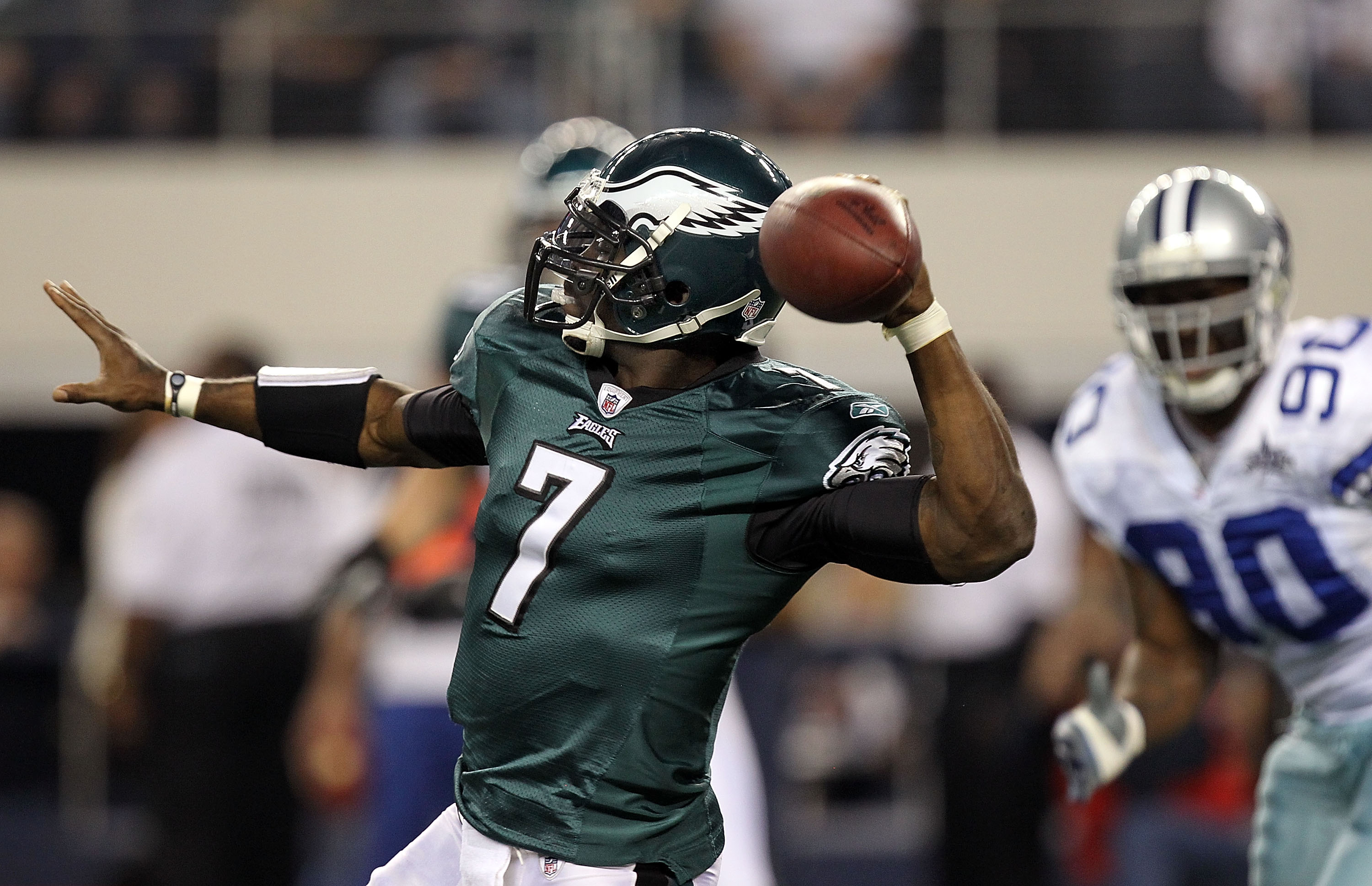ARLINGTON, TX - DECEMBER 12:  Quarterback Michael Vick #7 of the Philadelphia Eagles drops back to pass against the Dallas Cowboys at Cowboys Stadium on December 12, 2010 in Arlington, Texas.  (Photo by Ronald Martinez/Getty Images)