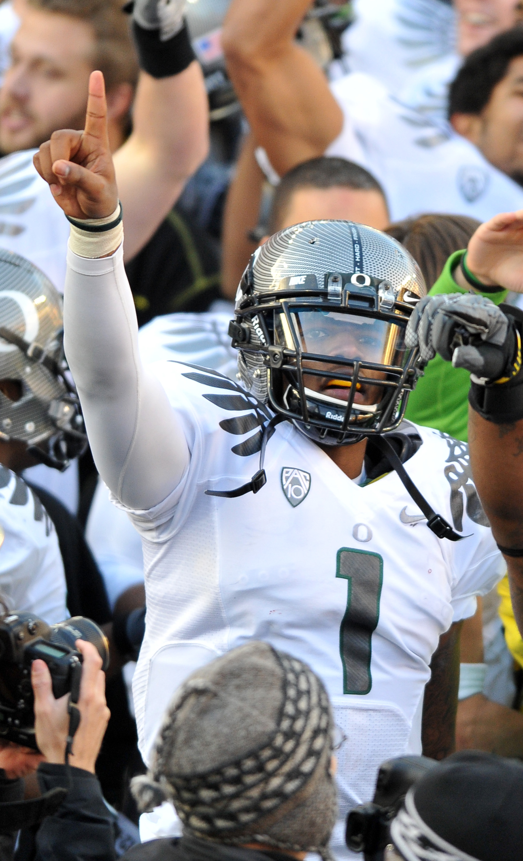 CORVALLIS, OR - DECEMBER 4: Quarterback Darron Thomas #1 of the Oregon Ducks signals to the fans in the stands after the game at Reser Stadium on December 4, 2010 in Corvallis, Oregon. he Ducks beat the Beavers 37-20 to likely go on the BCS Championship g