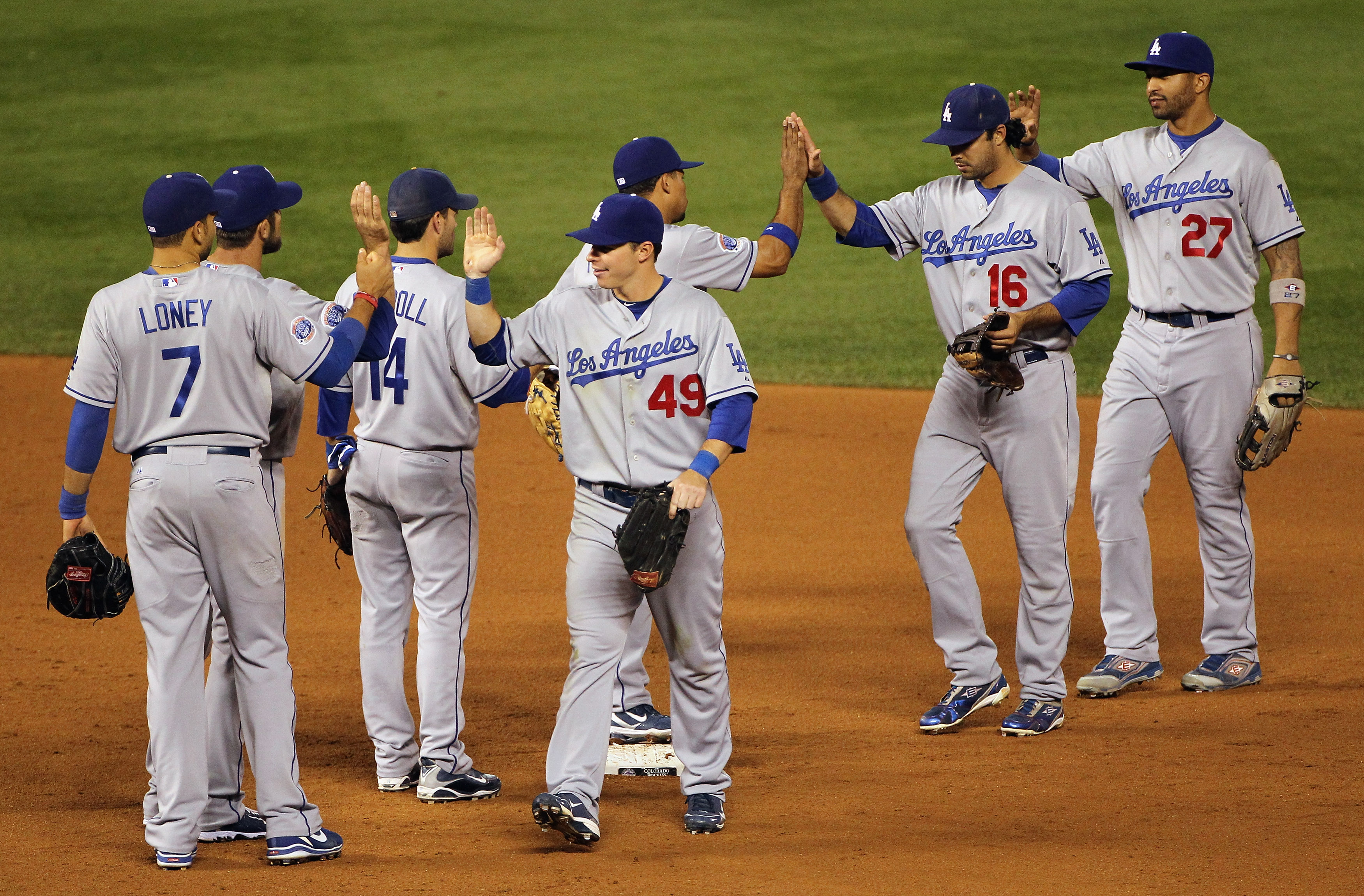 DENVER - SEPTEMBER 27:  The Los Angeles Dodgers celebrate their victory over the Colorado Rockies at Coors Field on September 25, 2010 in Denver, Colorado.The Dodgers defeated the Rockies 3-1.  (Photo by Doug Pensinger/Getty Images)