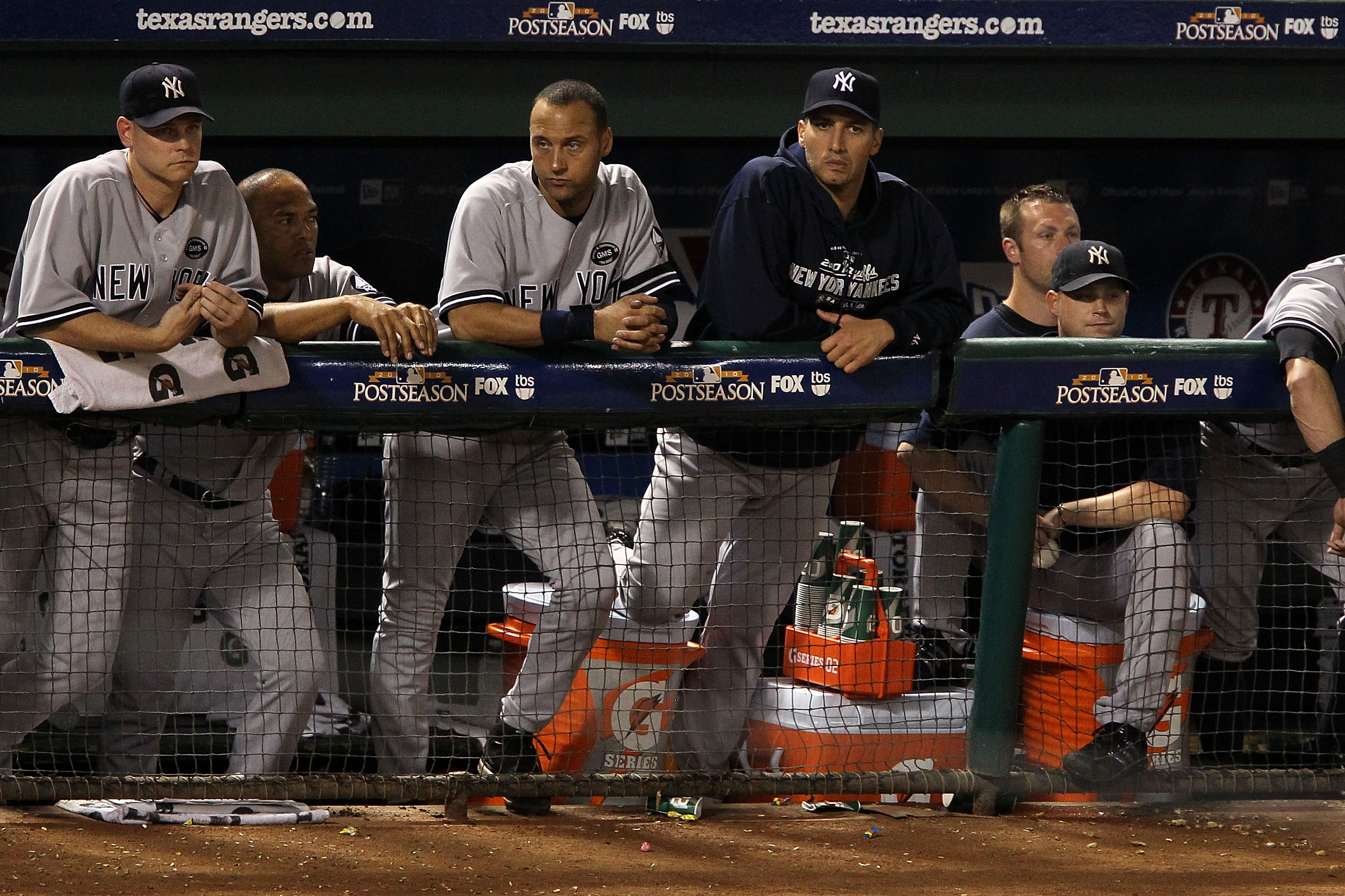ARLINGTON, TX - OCTOBER 22:  (L-R) Kerry Wood #39, Mariano Rivera #42, Derek Jeter #2, and Andy Pettitte #46 of the New York Yankees look on from the dugout during Game Six of the ALCS against the Texas Rangers during the 2010 MLB Playoffs at Rangers Ball