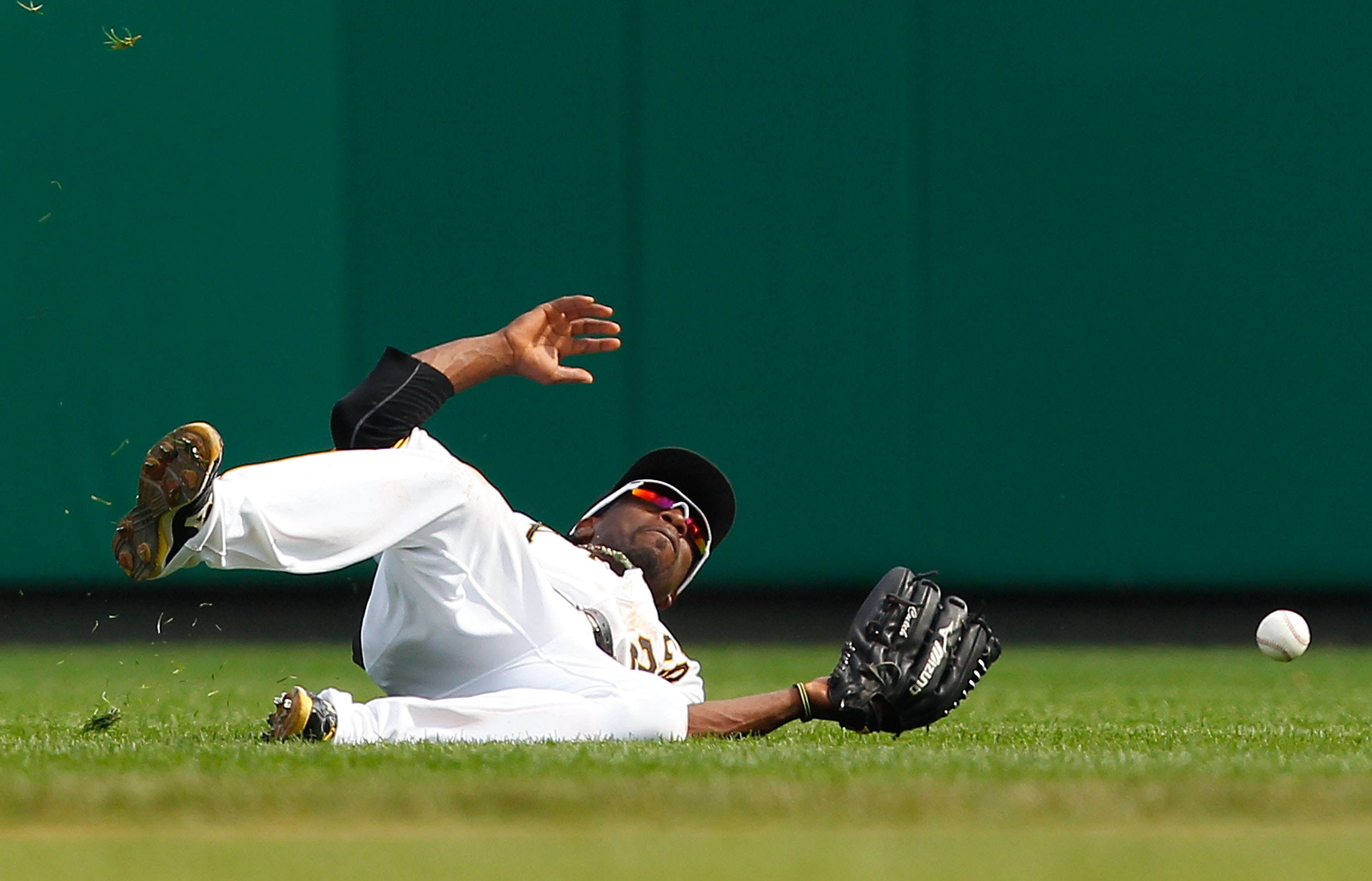 PITTSBURGH - SEPTEMBER 23:  Andrew McCutchen #22 of the Pittsburgh Pirates misses a fly ball in the outfield during the game against the St Louis Cardinals on September 23, 2010 at PNC Park in Pittsburgh, Pennsylvania.  (Photo by Jared Wickerham/Getty Ima
