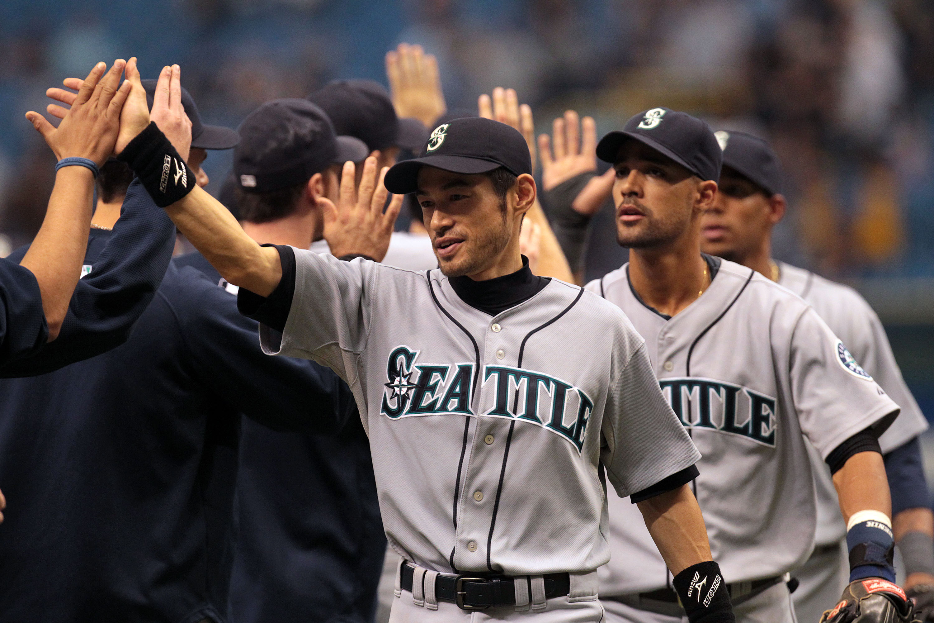 ST PETERSBURG, FL - SEPTEMBER 26: Ichiro Suzuki #51 of the Seattle Mariners celebrates a 6-2 win with teammates against the Tampa Bay Rays at Tropicana Field on September 26, 2010 in St. Petersburg, Florida. (Photo by Eliot J. Schechter/Getty Images)