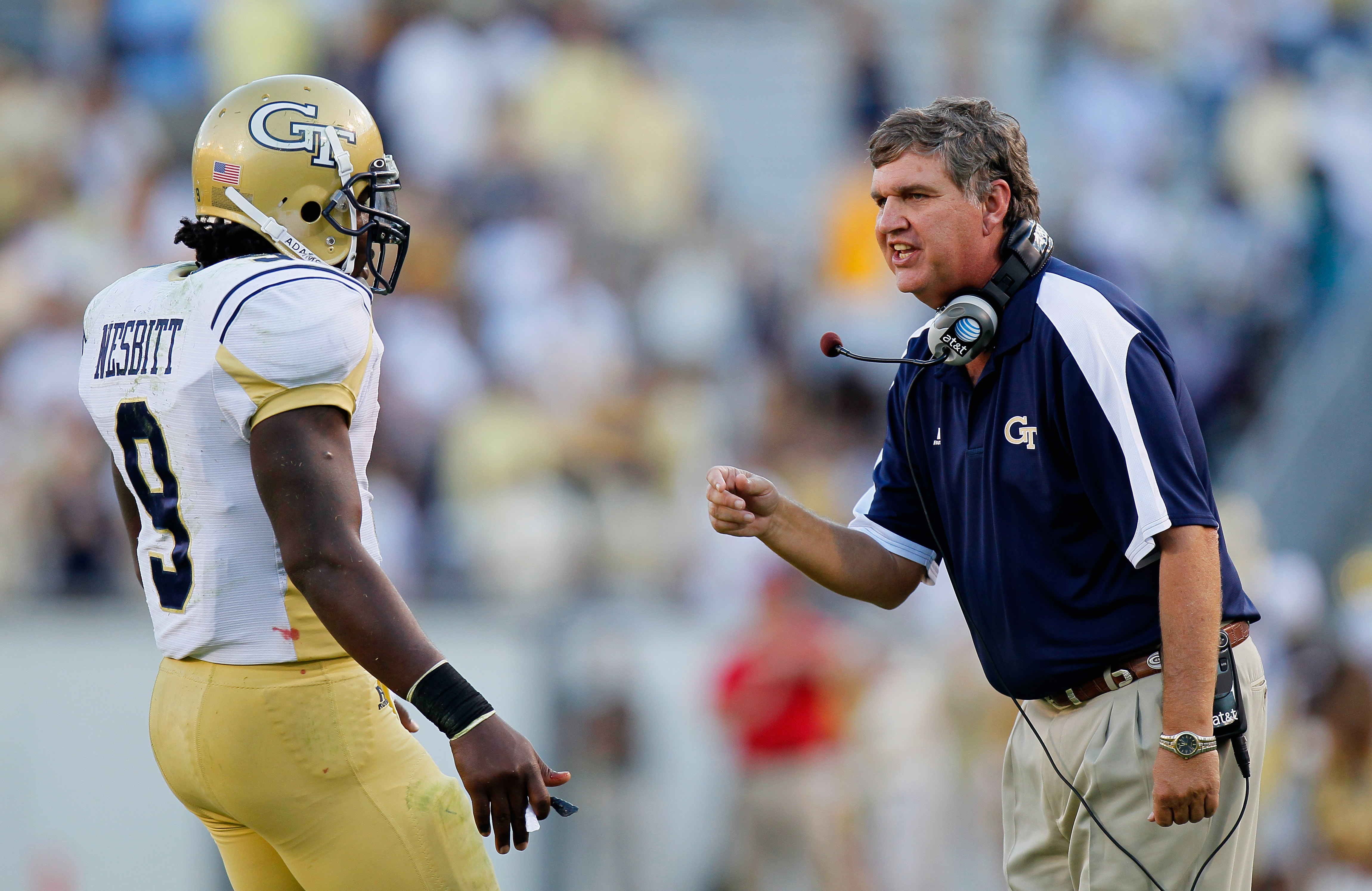 ATLANTA - OCTOBER 09: Head coach Paul Johnson converses with quarterback Joshua Nesbitt #9 of the Georgia Tech Yellow Jackets in between downs against the Virginia Cavaliers at Bobby Dodd Stadium on October 9, 2010 in Atlanta, Georgia. (Photo by Kevin C