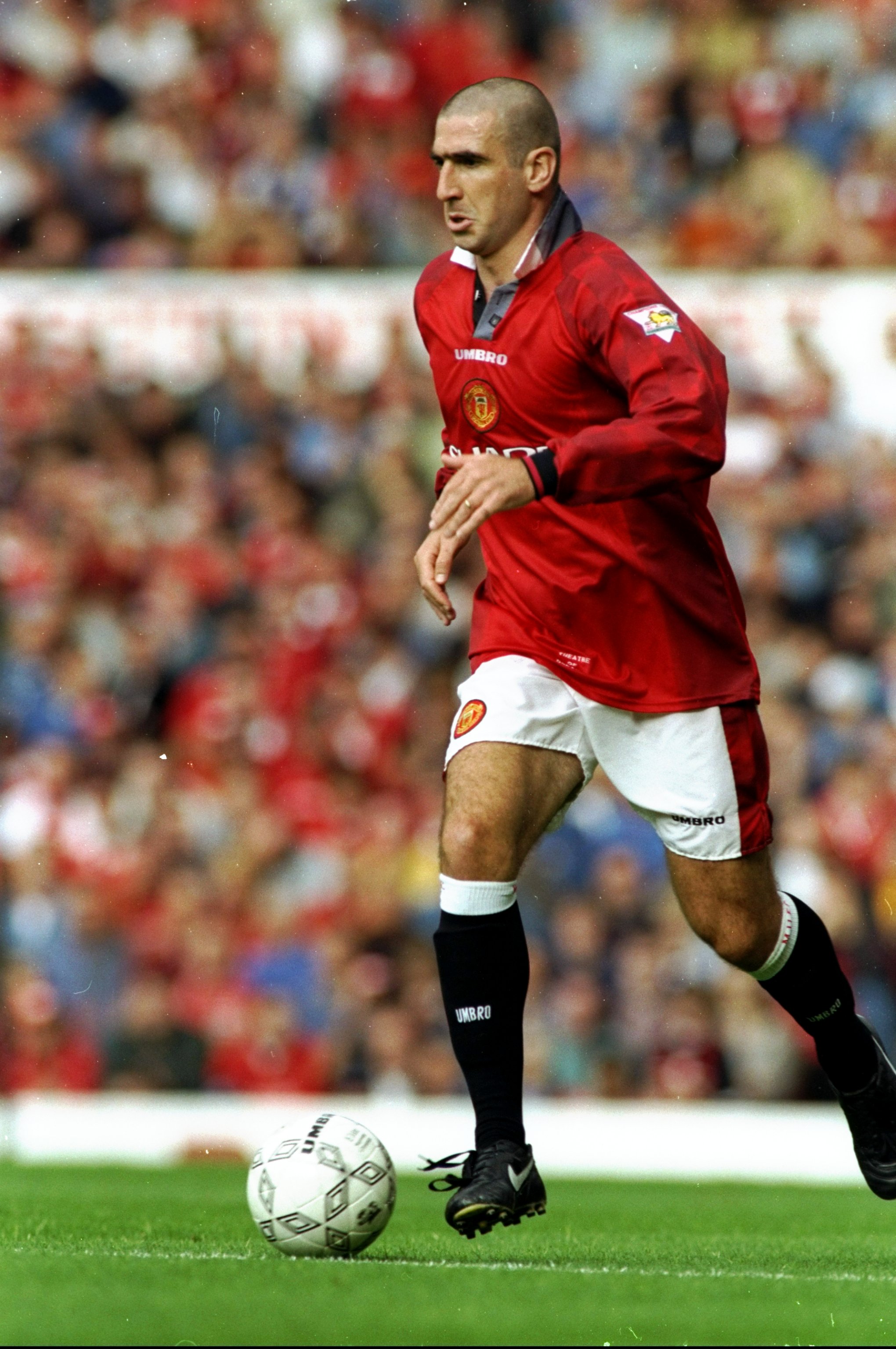 20 Aug 1996:  Eric Cantona of Manchester United in action during an FA Carling Premiership match against Blackburn Rovers at Old Trafford in Manchester, England. The match ended in a 2-2 draw. \ Mandatory Credit: Clive  Brunskill/Allsport