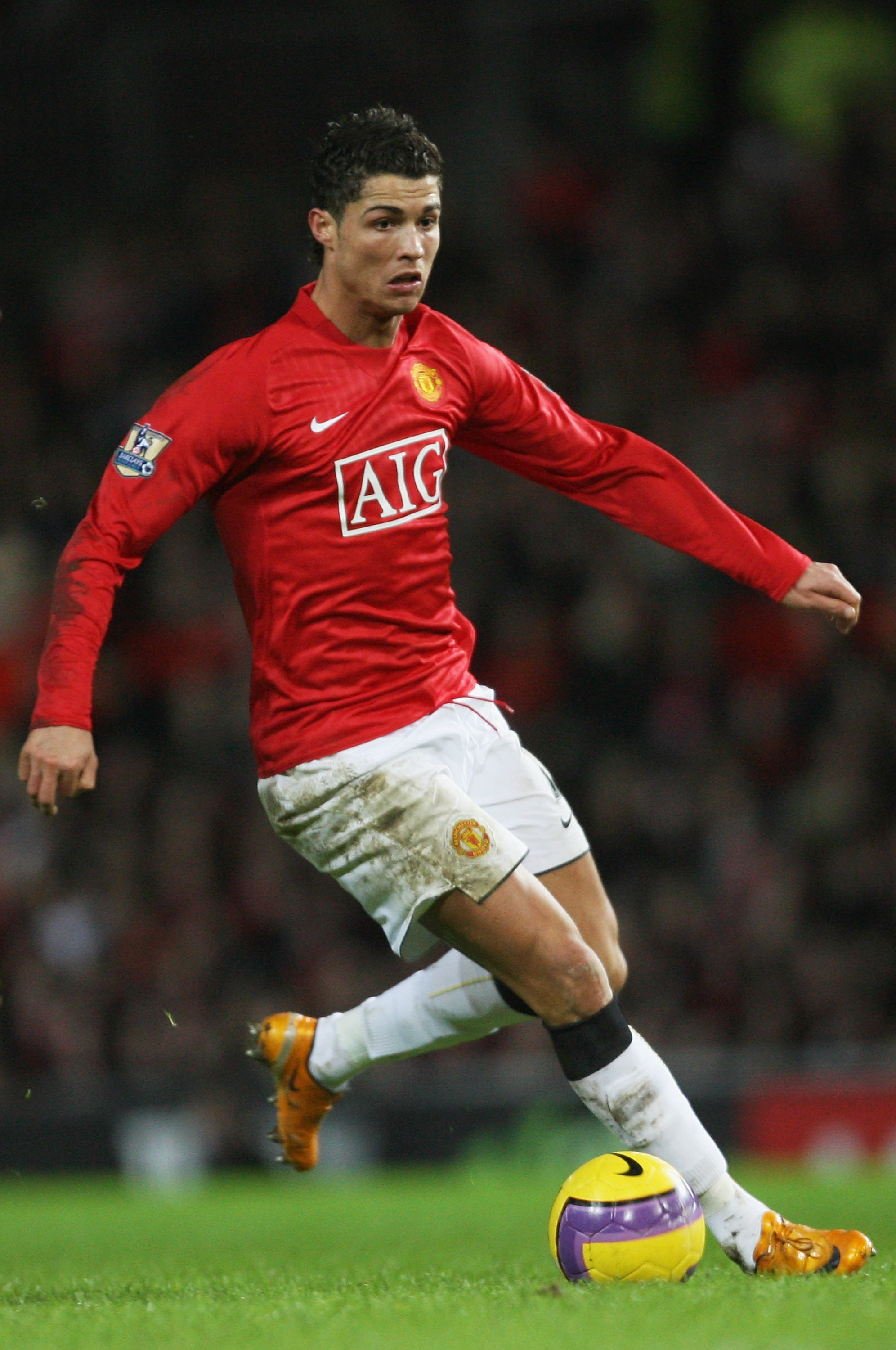 MANCHESTER, UNITED KINGDOM - JANUARY 12:  Cristiano Ronaldo of Manchester runs with the ball during the Barclays Premier League match between Manchester United and Newcastle United at Old Trafford on January 12, 2008 in Manchester, England.  (Photo by Ale