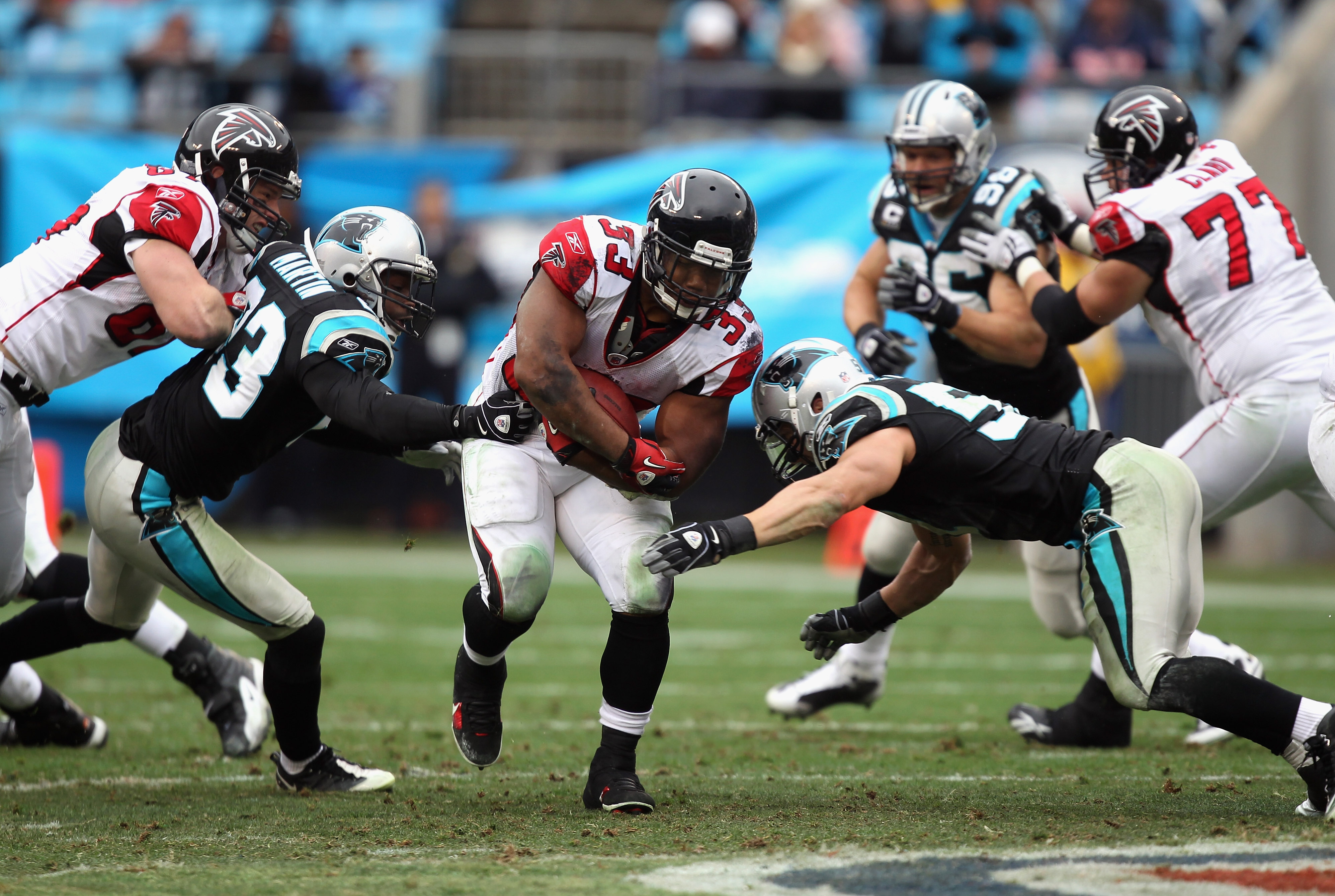 Michael Turner of the Atlanta Falcons runs with the ball during their