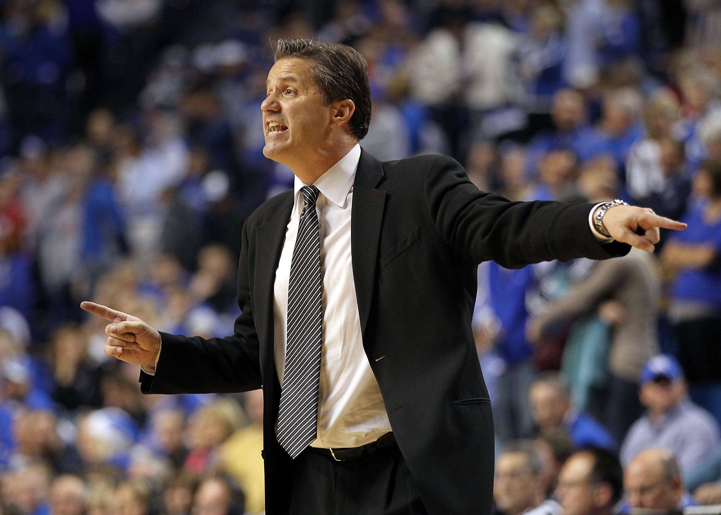 LEXINGTON, KY - DECEMBER 11:  John Calipari the Head Coach of the Kentucky Wildcats gives instructions to his team during the 81-62 victory over the Indiana Hoosiers on December 11, 2010 in Lexington, Kentucky.  (Photo by Andy Lyons/Getty Images)