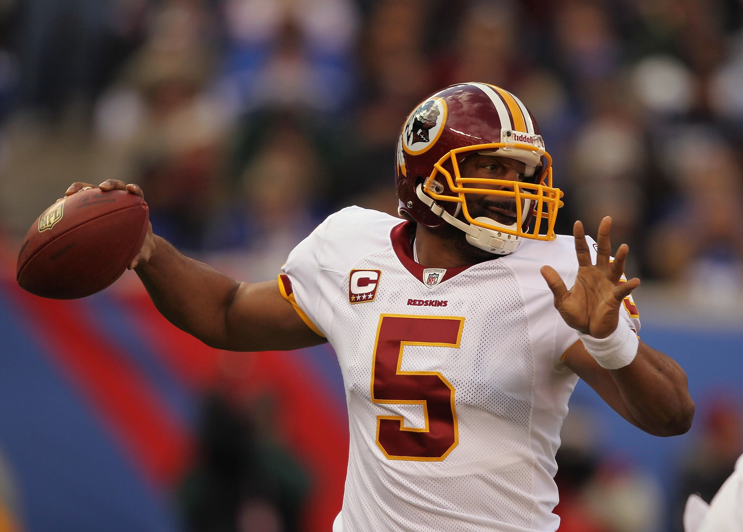 EAST RUTHERFORD, NJ - DECEMBER 05: Donovan McNabb #5 of the Washington Redskins passes the ball against the New York Giants apply pressure during their game on December 5, 2010 at The New Meadowlands Stadium in East Rutherford, New Jersey. (Photo by A EAST RUTHERFORD, NJ - DECEMBER 05: Donovan McNabb #5 of the Washington Redskins passes the ball against the New York Giants apply pressure during their game on December 5, 2010 at The New Meadowlands Stadium in East Rutherford, New Jersey. (Photo by A