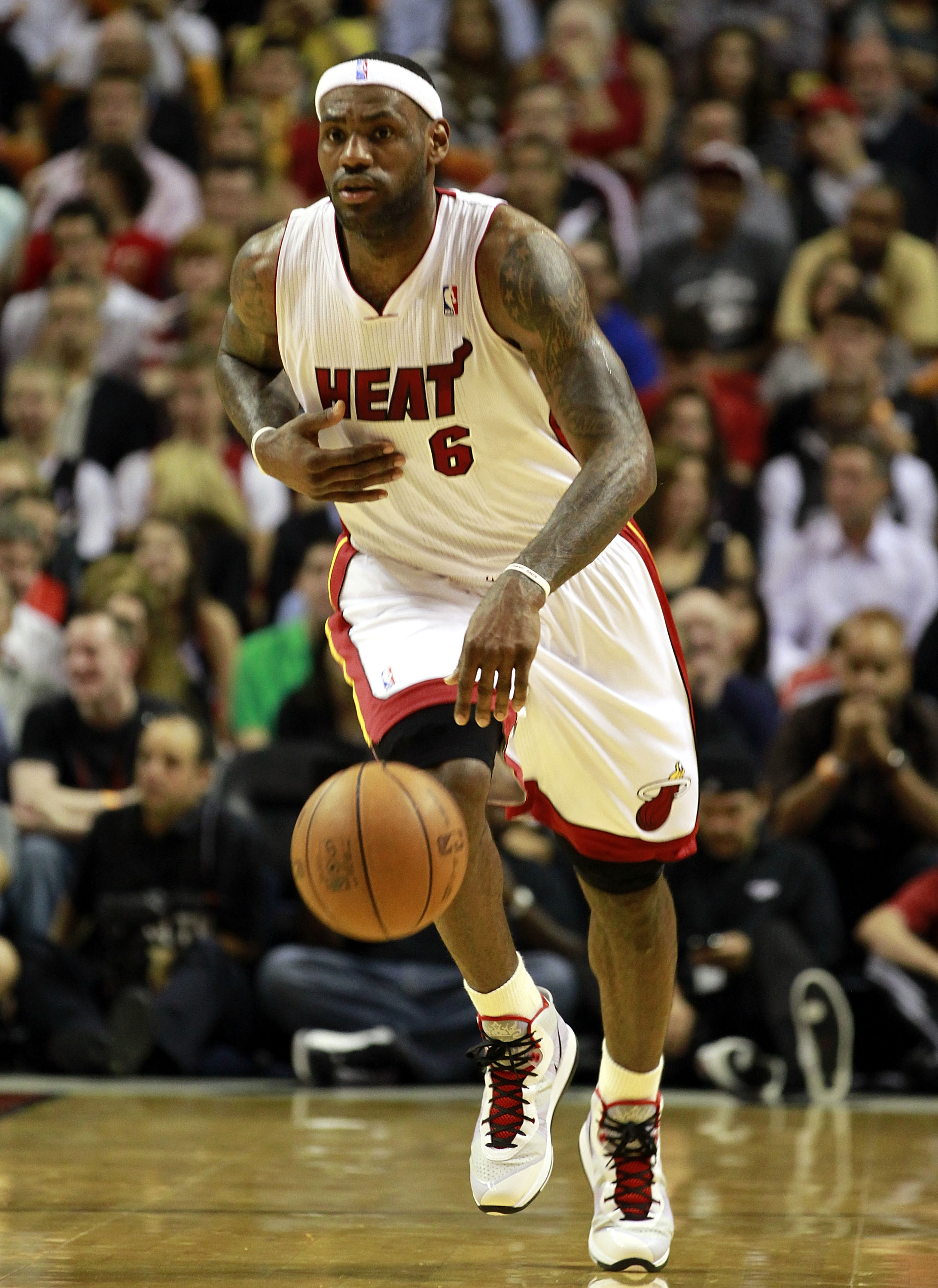 MIAMI, FL - JANUARY 01: Forward LeBron James #6 of the Miami Heat brings up the ball against the Golden State Warriors at American Airlines Arena on January 1, 2011 in Miami, Florida. NOTE TO USER: User expressly acknowledges and agrees that, by downloa