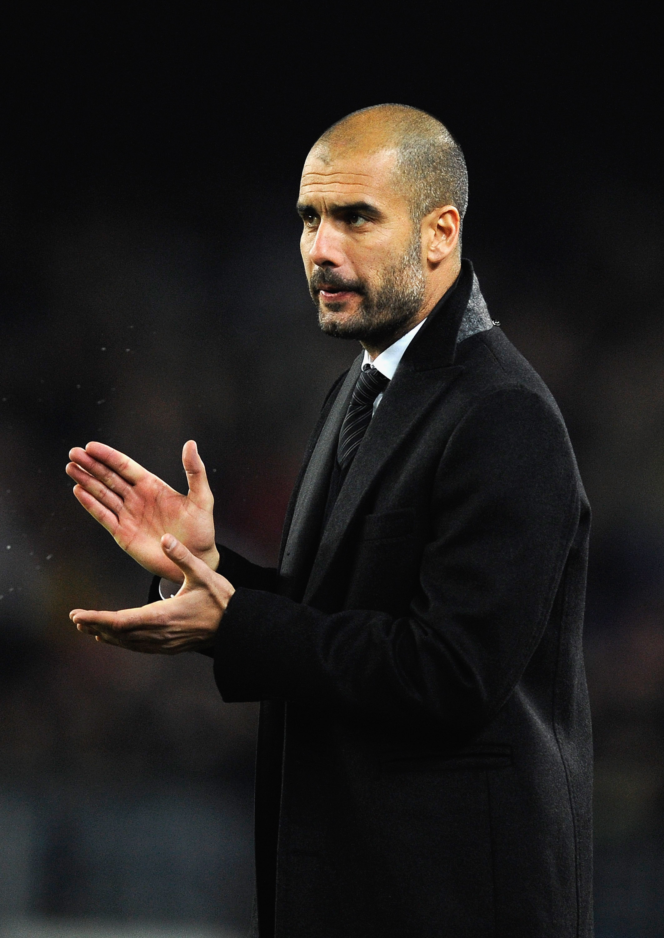 BARCELONA, SPAIN - DECEMBER 12:  Head coach Josep Guardiola of Barcelona claps his hands during the La Liga match between Barcelona and Real Sociedad at Camp Nou Stadium on December 12, 2010 in Barcelona, Spain. Barcelona won the match 5-0.  (Photo by Dav