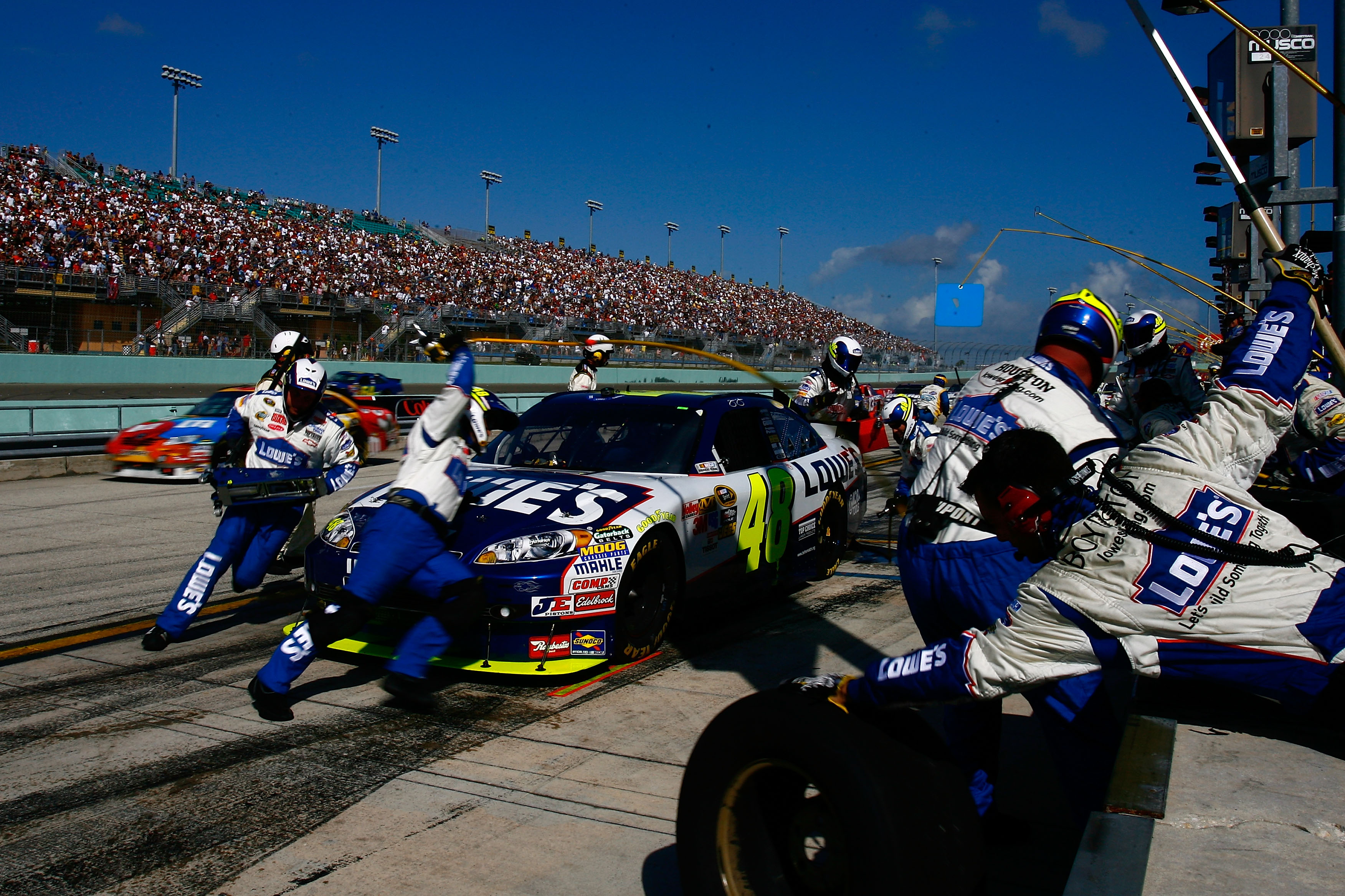 HOMESTEAD, FL - NOVEMBER 21:  Jimmie Johnson, driver of the #48 Lowe's Chevrolet, makes a pit stop during the NASCAR Sprint Cup Series Ford 400 at Homestead-Miami Speedway on November 21, 2010 in Homestead, Florida.  (Photo by Jason Smith/Getty Images for