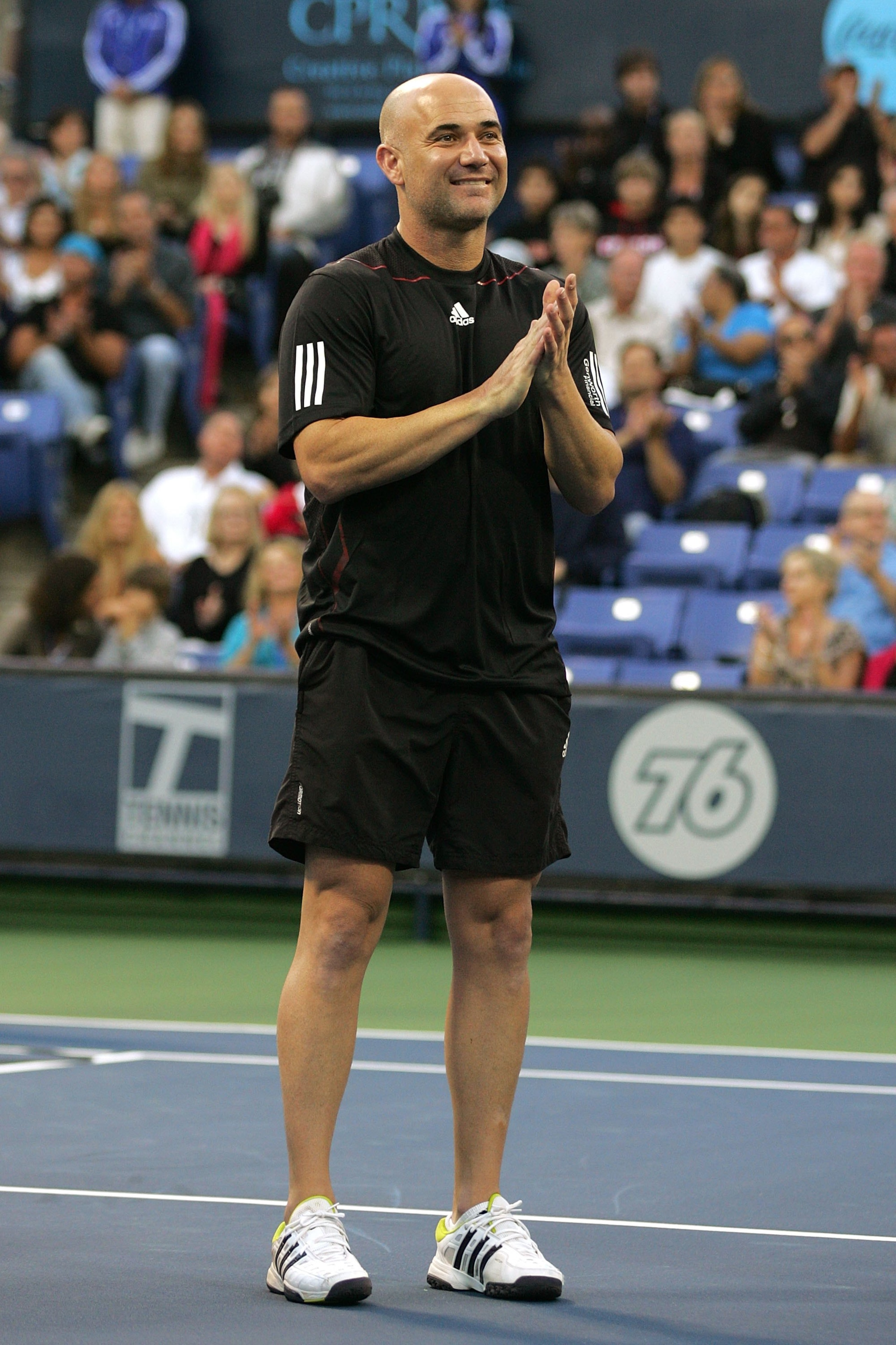 LOS ANGELES, CA - JULY 24:  Andre Agassi stands during a check presentation before playing against John McEnroe in the Stars Under the Stars gala on July 24, 2010 at the Los Angeles Tennis Center in Los Angeles, California.  (Photo by Jeff Golden/Getty Im