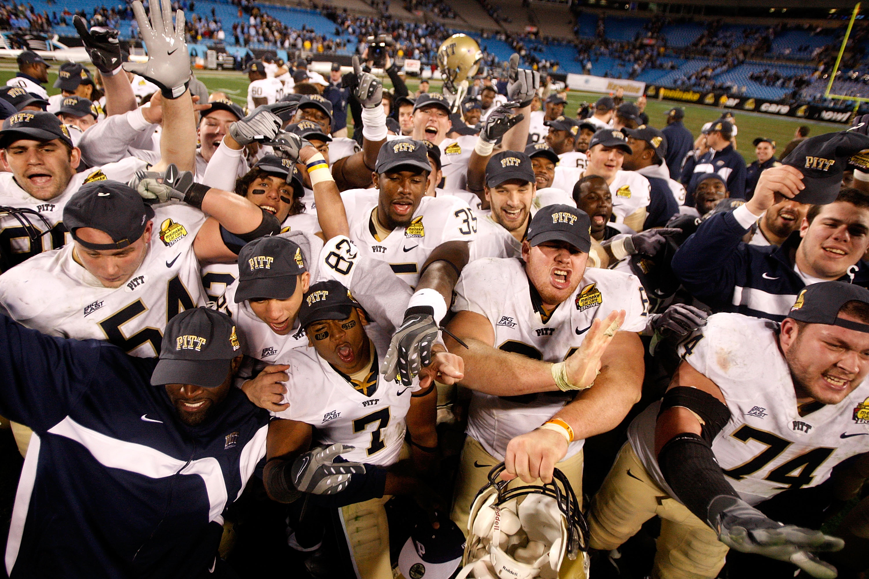 CHARLOTTE, NC - DECEMBER 26:  The Pittsburgh Panthers celebrate a 19-17 victory over the North Carolina Tar Heels after their game on December 26, 2009 in Charlotte, North Carolina.  (Photo by Streeter Lecka/Getty Images)