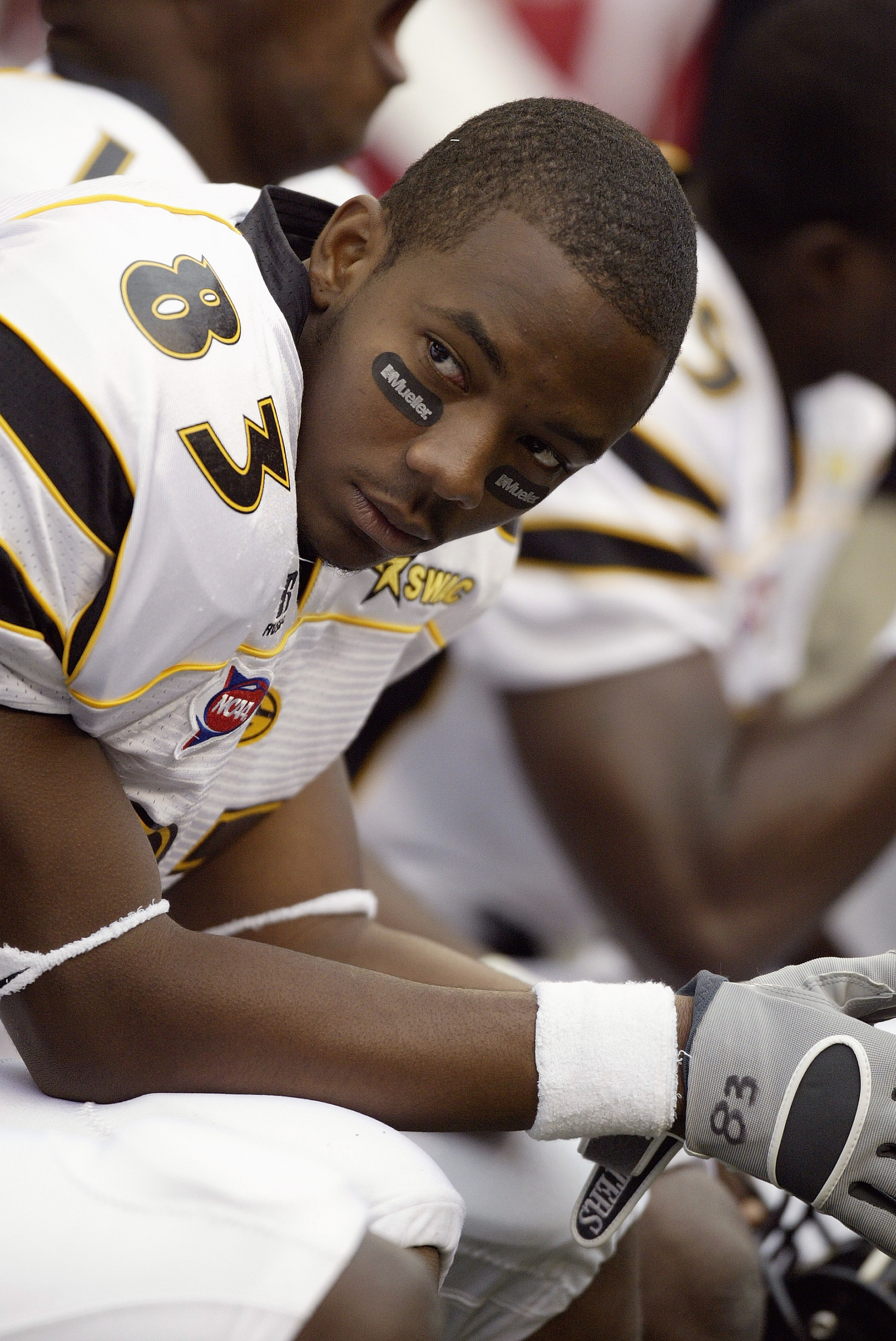 SEATTLE - SEPTEMBER 17:  Wide receiver Xavier Jackson #83 of the Grambling State University Tigers looks on as he sits on a sideline bench during a NCAA game against the Washington State University Cougars at Quest Field on September 17, 2005 in Seattle W