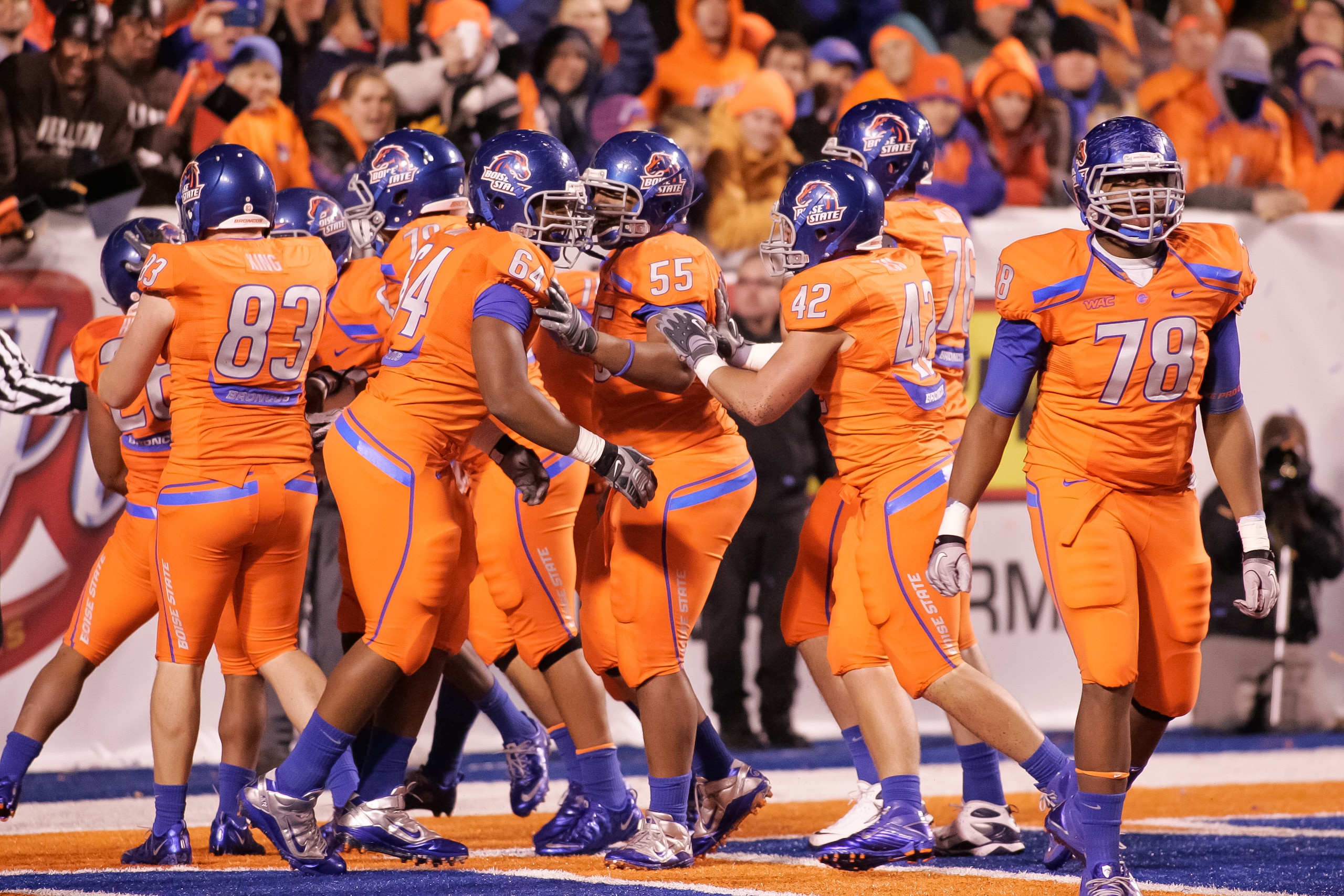 BOISE, ID - NOVEMBER 19: The Boise State Broncos celebrate after a touchdown against the Fresno State Bulldogs at Bronco Stadium on November 19, 2010 in Boise, Idaho. (Photo by Otto Kitsinger III/Getty Images) BOISE, ID - NOVEMBER 19: The Boise State Broncos celebrate after a touchdown against the Fresno State Bulldogs at Bronco Stadium on November 19, 2010 in Boise, Idaho. (Photo by Otto Kitsinger III/Getty Images)