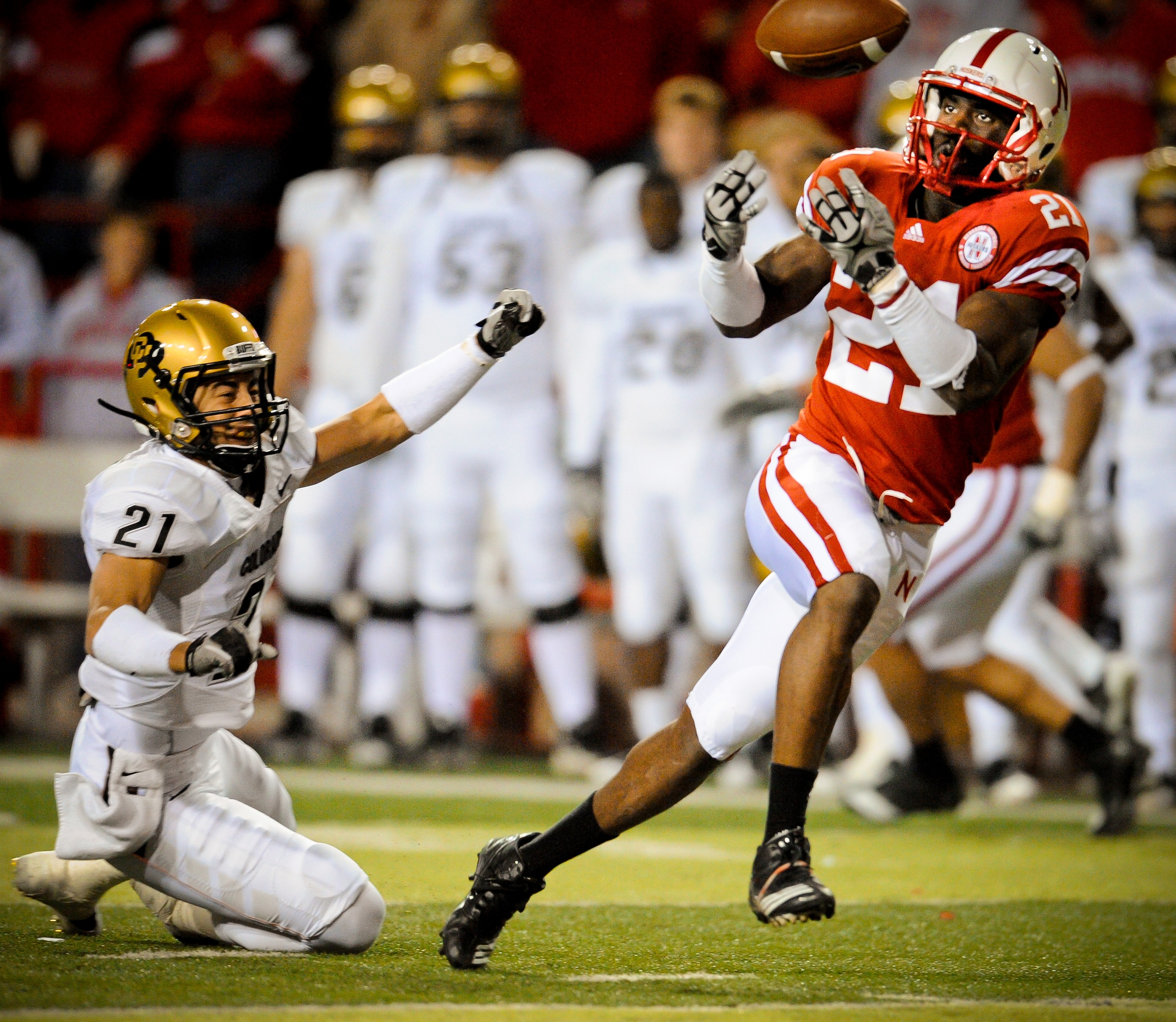 LINCOLN, NE - NOVEMBER 26: Prince Amukamara #21 of the Nebraska Cornhuskers misses a chance at an interception from Scotty McKnight #21 of the Colorado Buffaloes during the second half of their game at Memorial Stadium on November 26, 2010 in Lincoln, Neb LINCOLN, NE - NOVEMBER 26: Prince Amukamara #21 of the Nebraska Cornhuskers misses a chance at an interception from Scotty McKnight #21 of the Colorado Buffaloes during the second half of their game at Memorial Stadium on November 26, 2010 in Lincoln, Neb