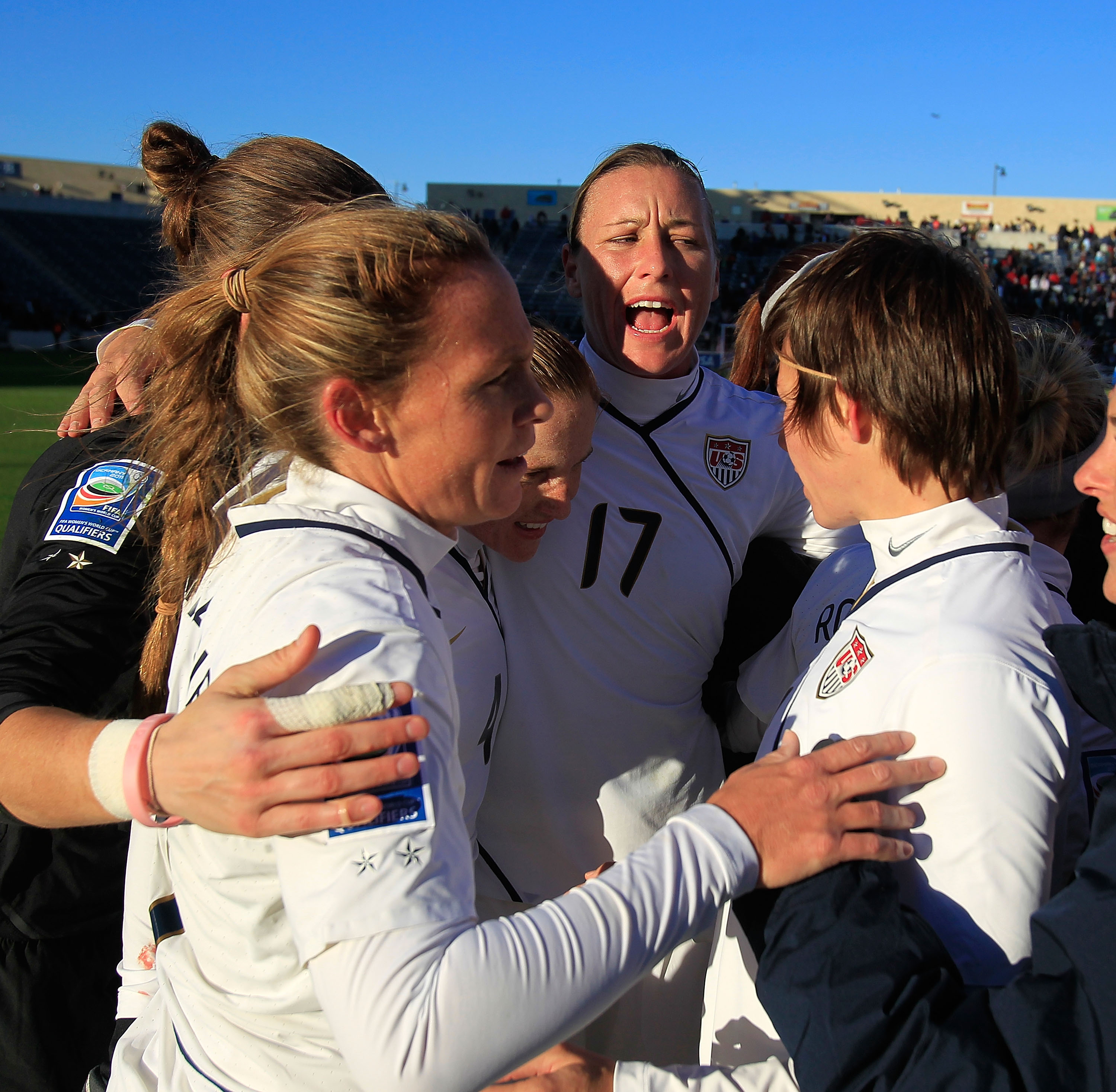 BRIDGEVIEW, IL - NOVEMBER 27: Members of the United States including (L-R) Christie Rampone #3, Nicole Barnhart #18, Rachel Buehler #4, Abby Wambach #17 and Amy LePeilbet #6 celebrate a win over Italy during a Women's World Cup Qualifying match at Toyota