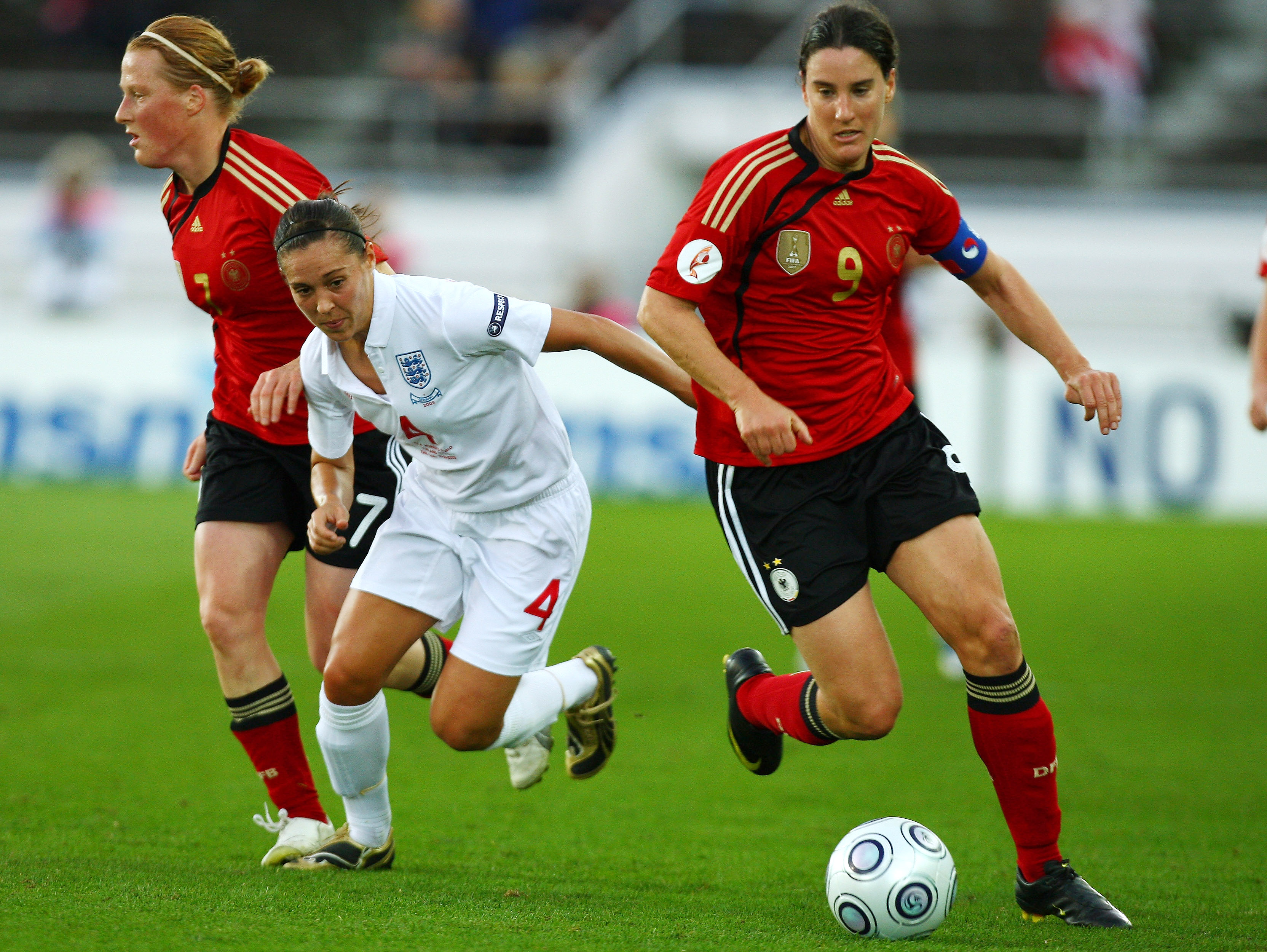 HELSINKI, FINLAND - SEPTEMBER 10:  Fara Williams of England attempts to tackle Birgit Prinz of Germany during the UEFA Women's Euro 2009 Final match between England and Germany at the Helsinki Olympic Stadium on September 10, 2009 in Helsinki, Finland.  (