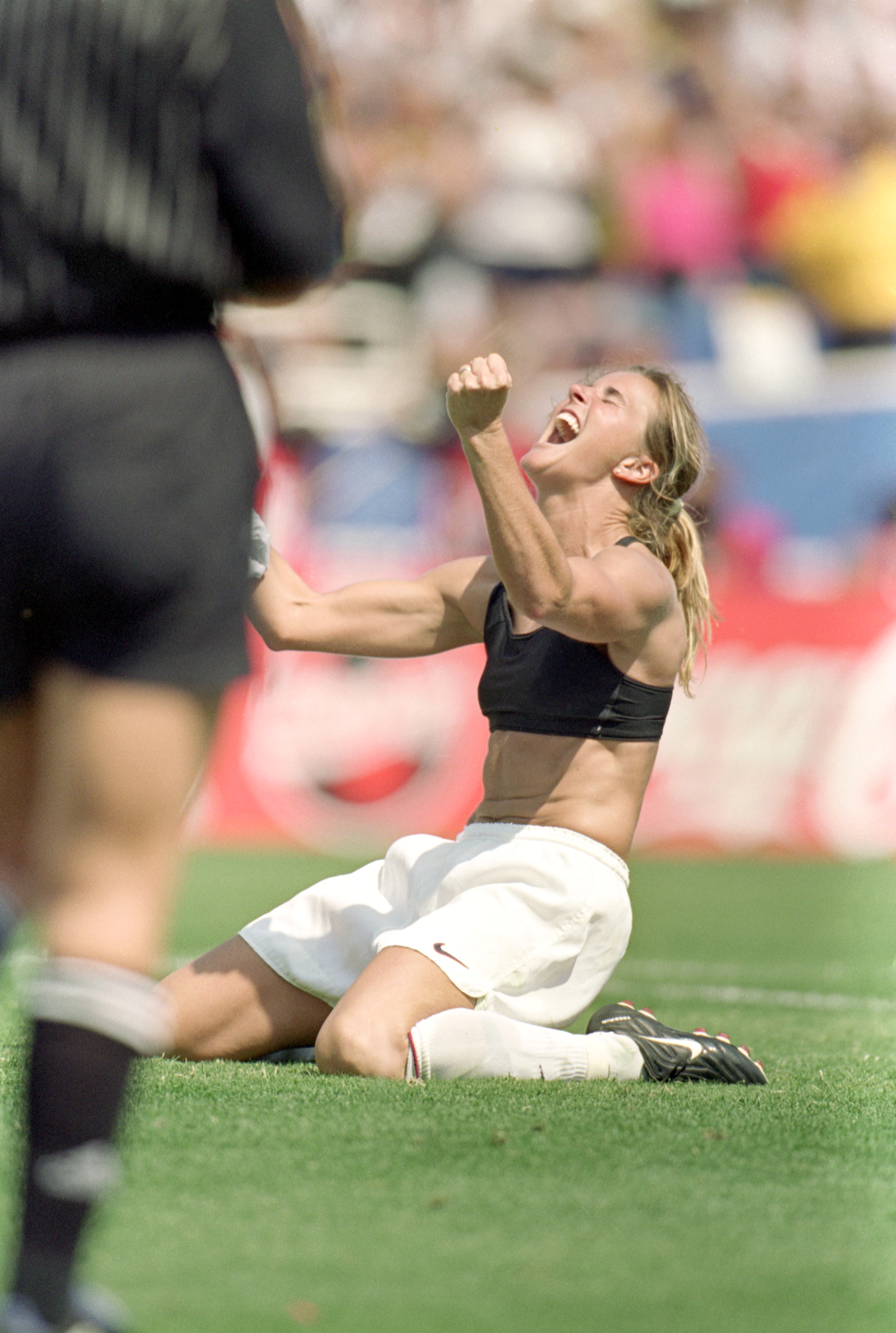 PASADENA, CA - JULY 10:  Brandi Chastain of Team USA celebrates during the Women's World Cup against Team China at The Rose Bowl on July 10, 1999 in Pasadena, California. Team USA won 5-4. (Photo by Jed Jacobsohn/Getty Images)