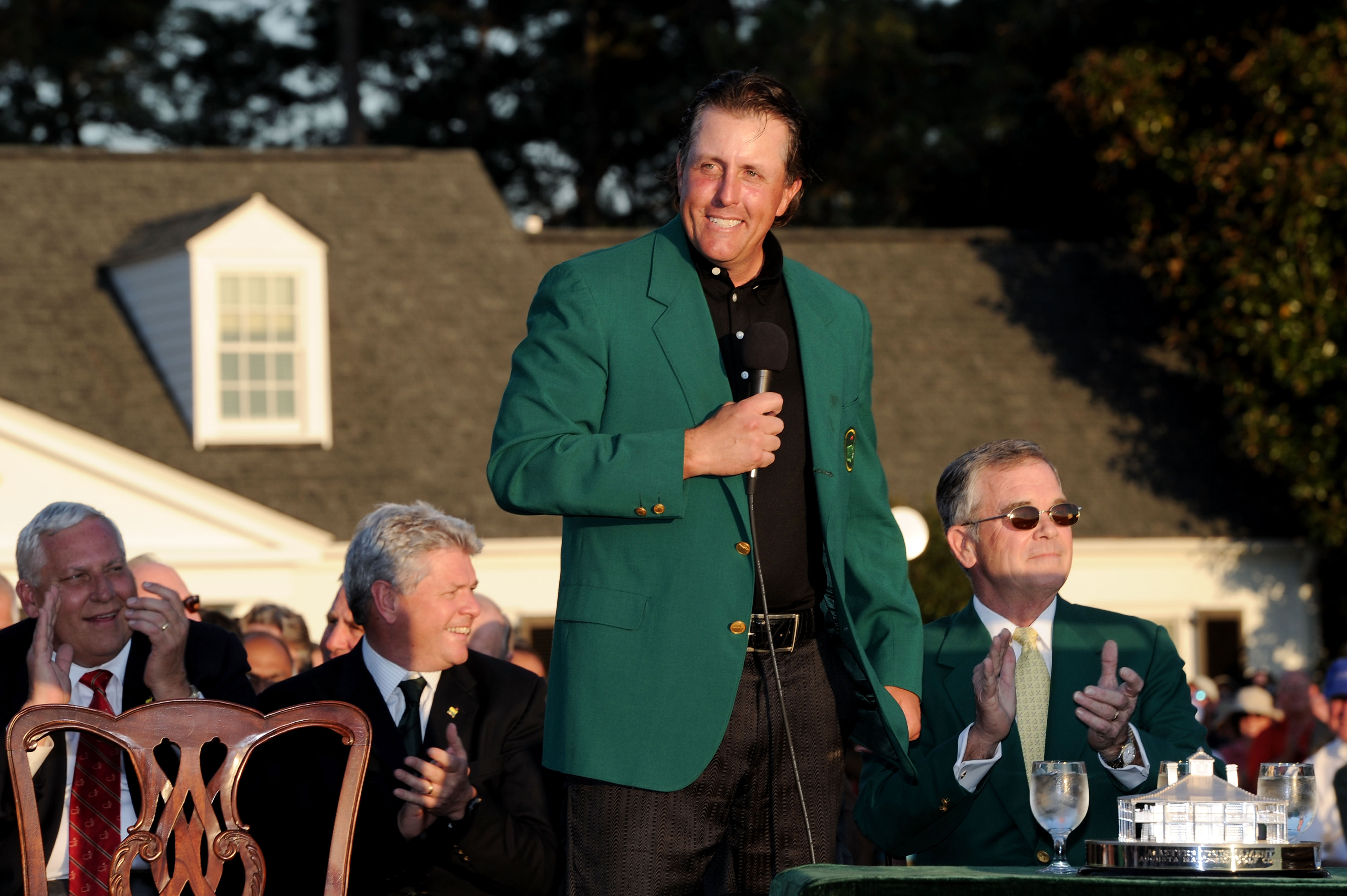 AUGUSTA, GA - APRIL 11:  Phil Mickelson speaks to the gallery as Augusta National Chairman William Porter 'Billy' Payne (R) looks on during the green jacket presentation after the final round of the 2010 Masters Tournament at Augusta National Golf Club on
