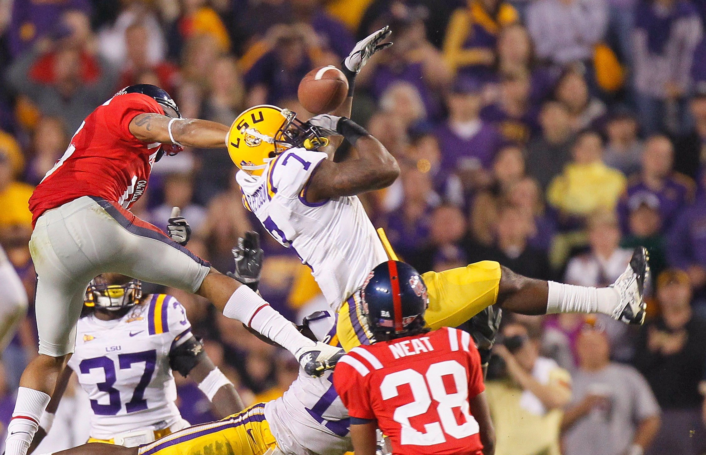 BATON ROUGE, LA - NOVEMBER 20:  Patrick Peterson #7 of the Louisiana State University Tigers nearly intercepts a pass in the final seconds against Markeith Summers #16 and Korvic Neat #28 of the Ole Miss Rebels as time expired at Tiger Stadium on November