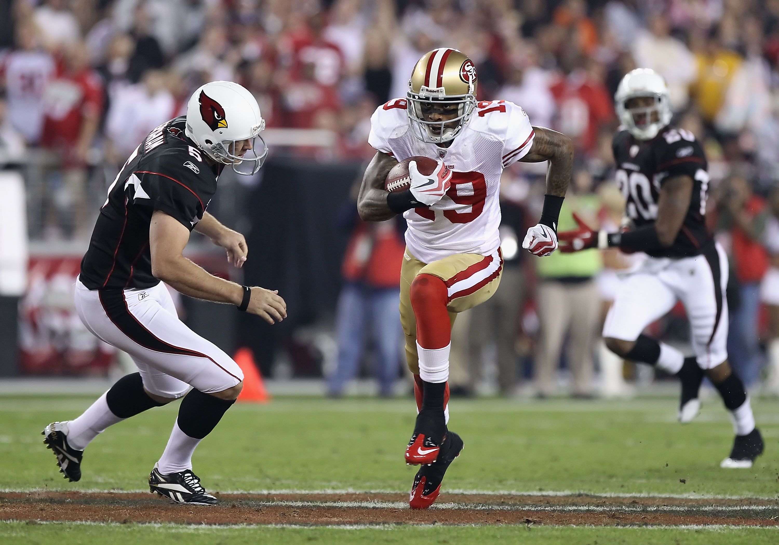 Ted Ginn Jr. #19 of the San Francisco 49ers standing on the field