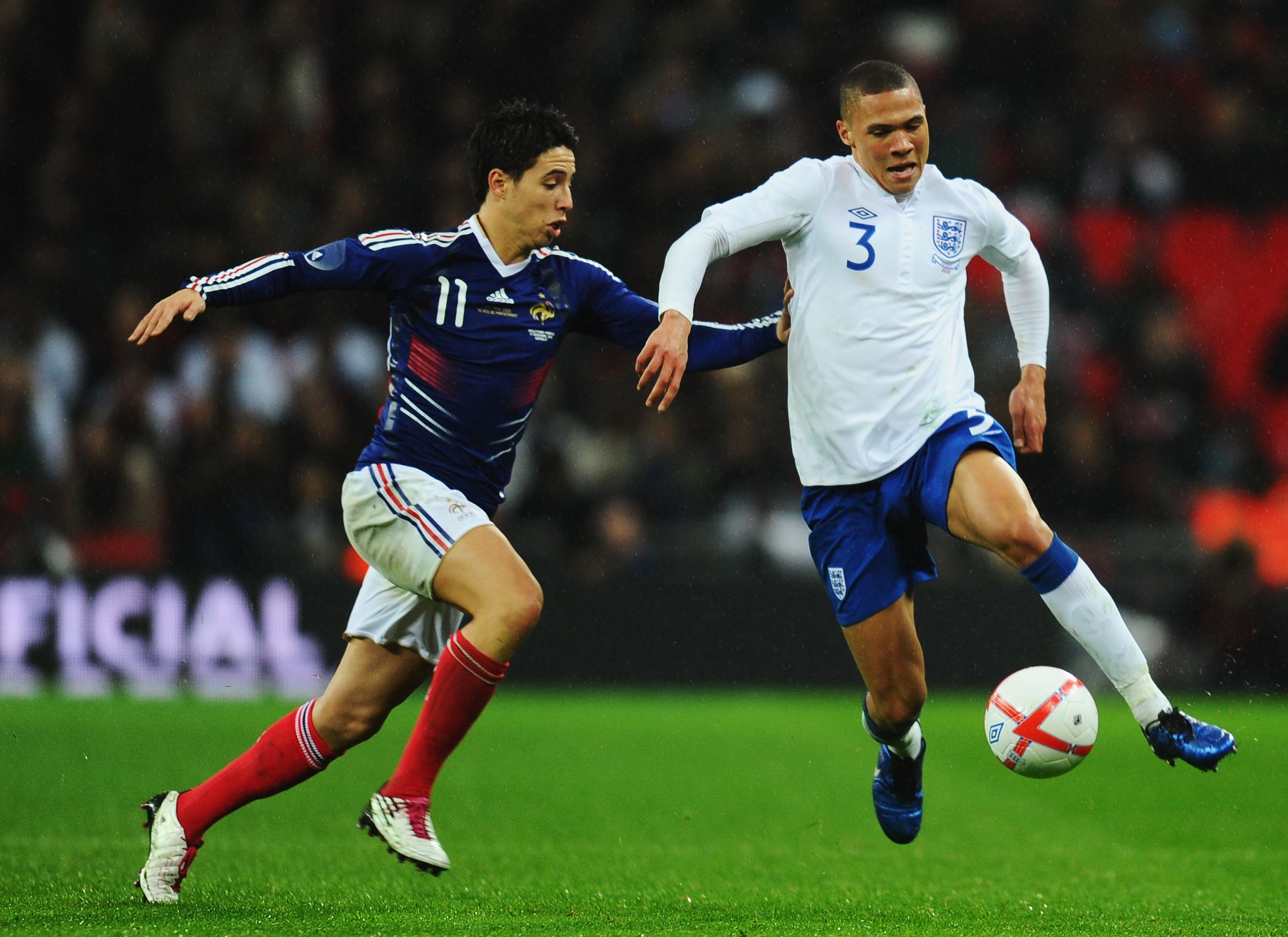 LONDON, ENGLAND - NOVEMBER 17:  Kieran Gibbs of England evades Samir Nasri of France during the international friendly match between England and France at Wembley Stadium on November 17, 2010 in London, England.  (Photo by Mike Hewitt/Getty Images)
