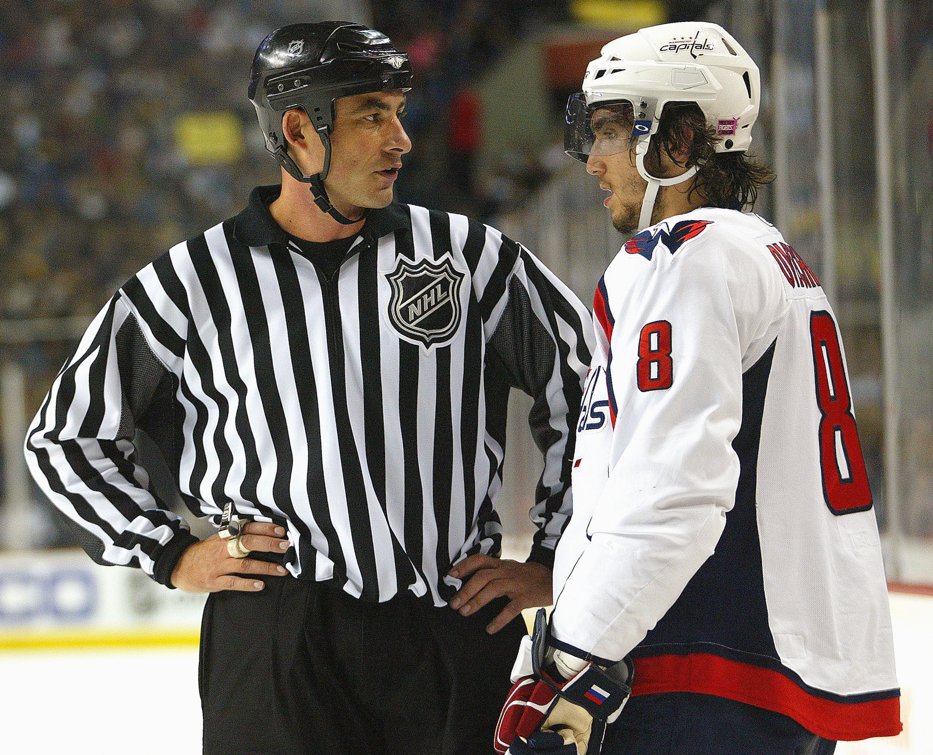 BUFFALO-OCTOBER 13:  Linesman Steve Barton chats with Alex Ovechkin #8 of the Washington Capitals during a stoppage in play in a game against the Buffalo Sabres on October 13, 2007 at the HSBC Arena in Buffalo, NewYork. The Sabres defeated the Capitals 7-