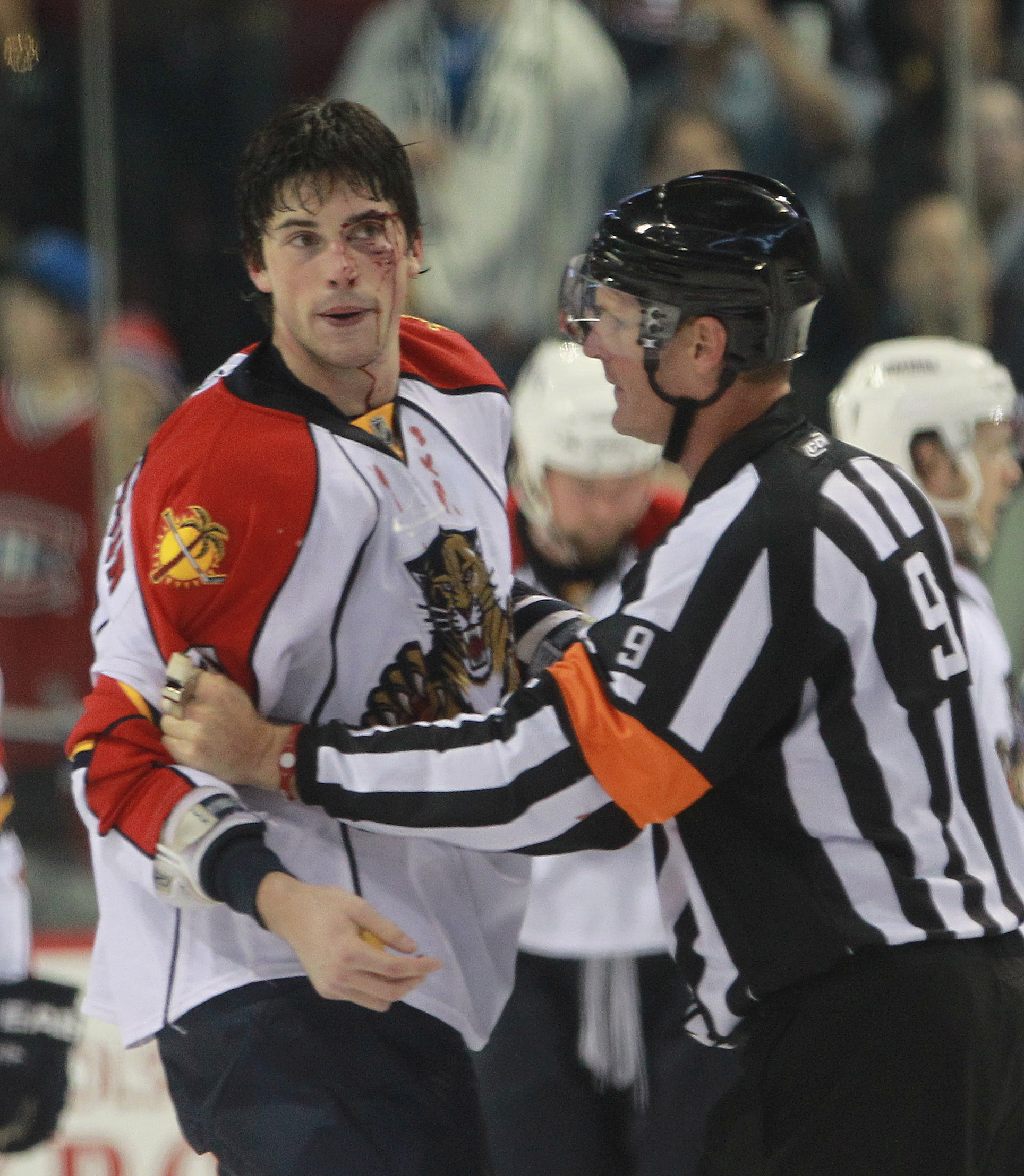 MONTREAL, QC - SEPTEMBER 27: Erik Gudbranson #44 of the Florida Panthers is held by referee Dan O'Rourke #9 following his fight with Travis Moen #32 of the Montreal Canadiens at the Bell Centre on September 27, 2010 in Montreal, Canada. The Canadiens def