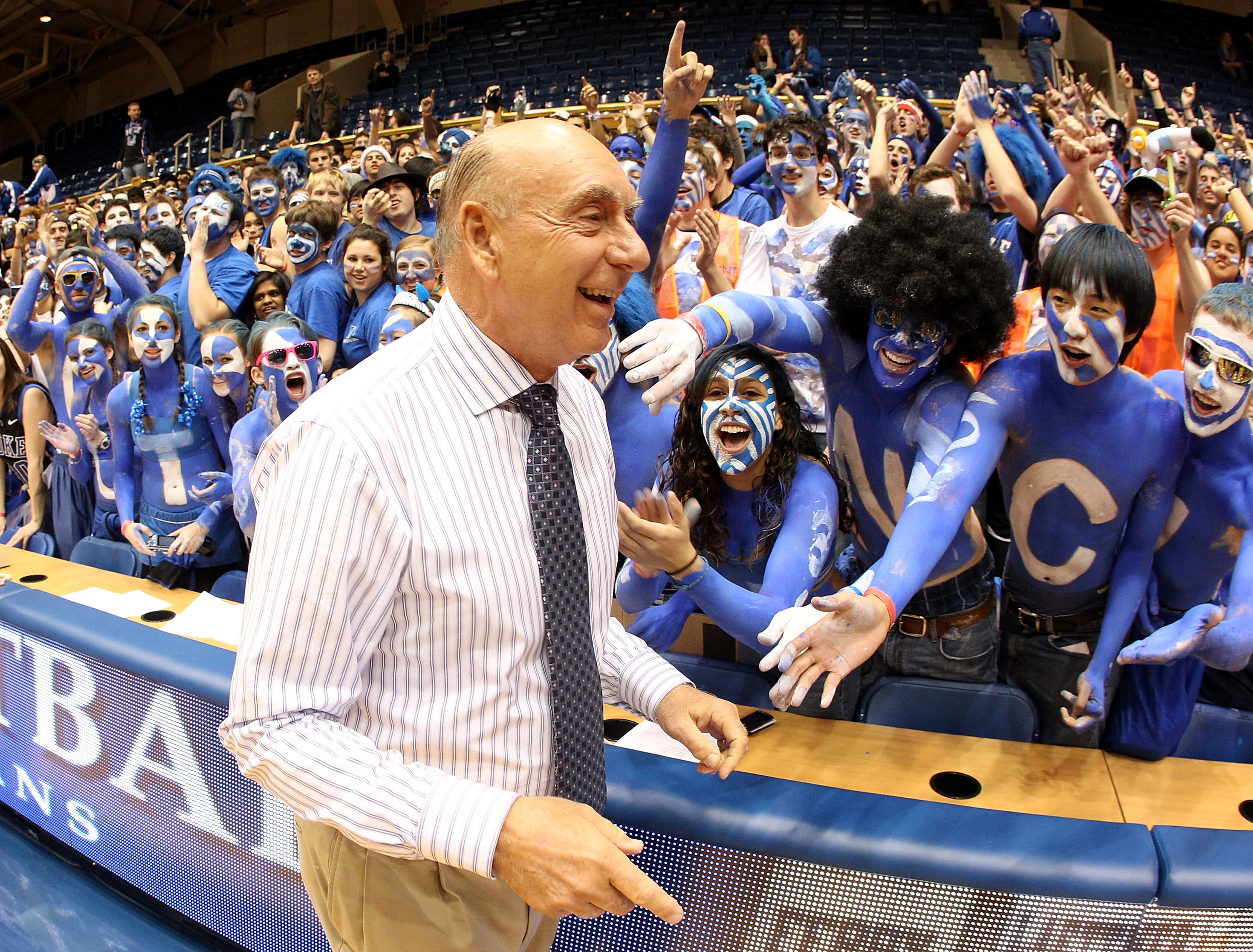 DURHAM, NC - MARCH 06:  ESPN analyst Dick Vitale celebrates with the Cameron Crazies before the start of the game between the North Carolina Tar Heels and Duke Blue Devils at Cameron Indoor Stadium on March 6, 2010 in Durham, North Carolina.  (Photo by St