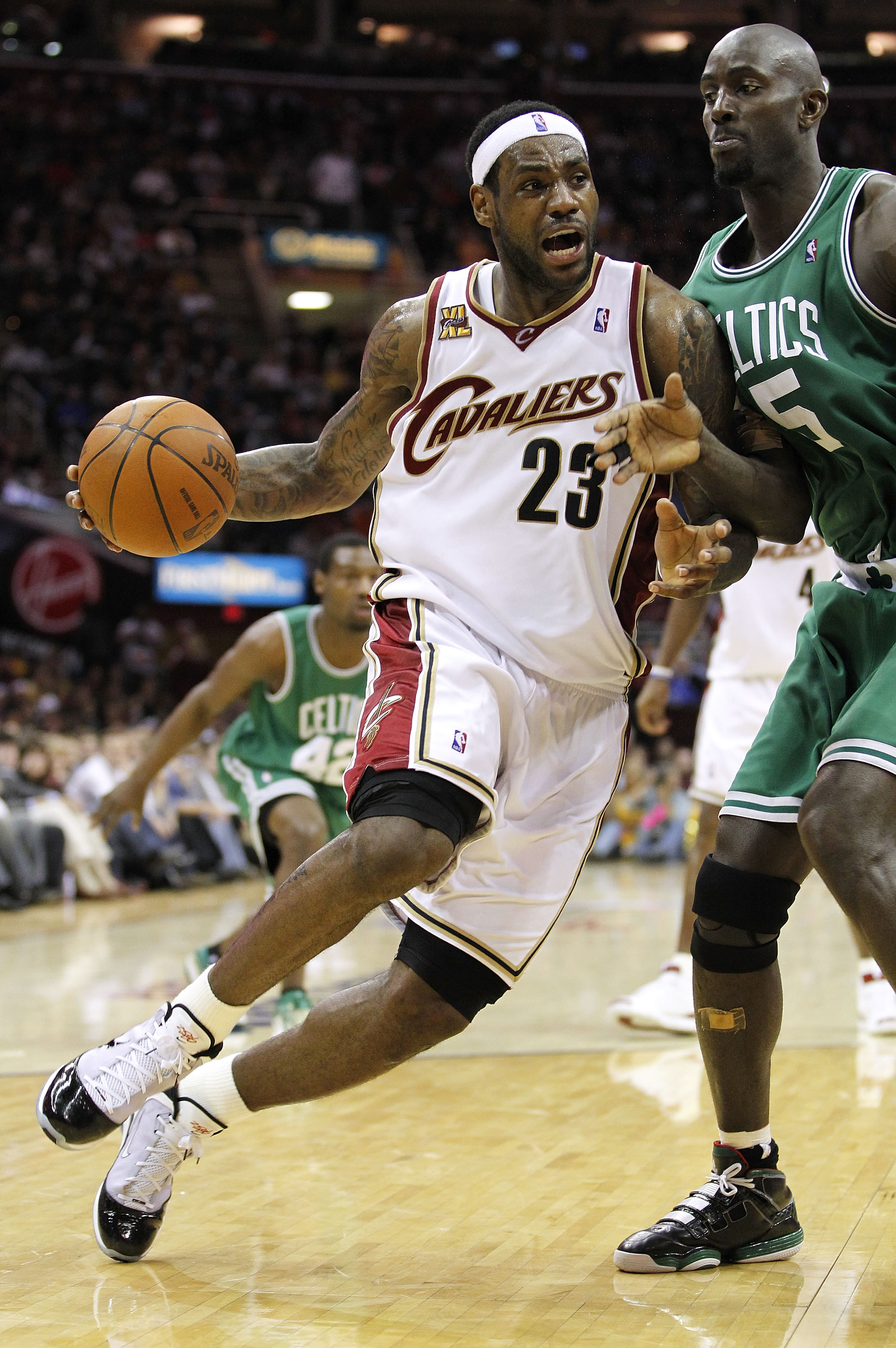 CLEVELAND - MAY 11:  LeBron James #23 of the Cleveland Cavaliers drives around Kevin Garnett #5 of the Boston Celtics during Game Five of the Eastern Conference Semifinals during the 2010 NBA Playoffs at Quicken Loans Arena on May 11, 2010 in Cleveland, O