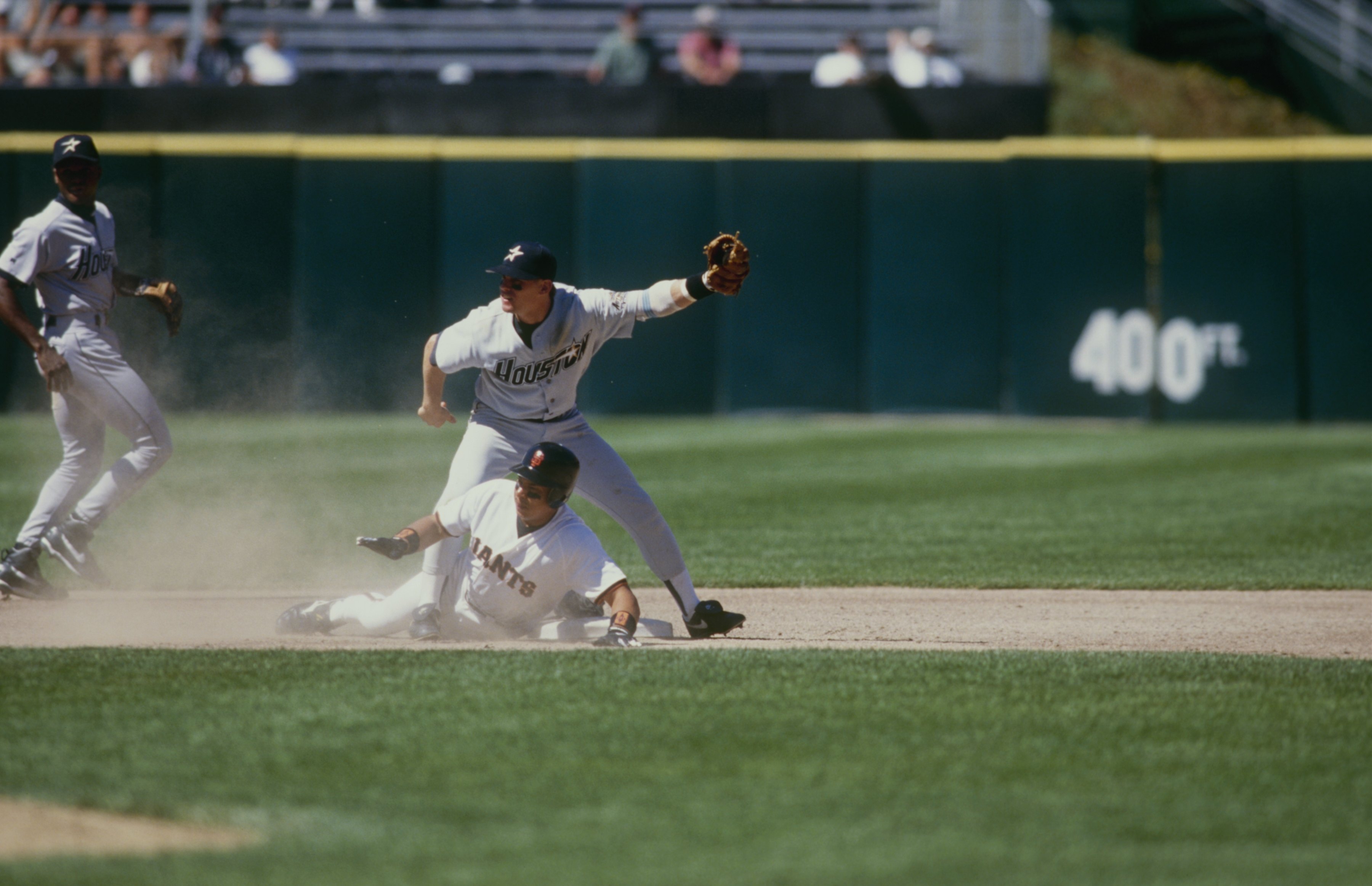 American League shortstop Derek Jeter completes a double play in the third  inning as National League Chase Utley slides into second base at the 2006  Major League Baseball All-Star Game in Pittsburgh