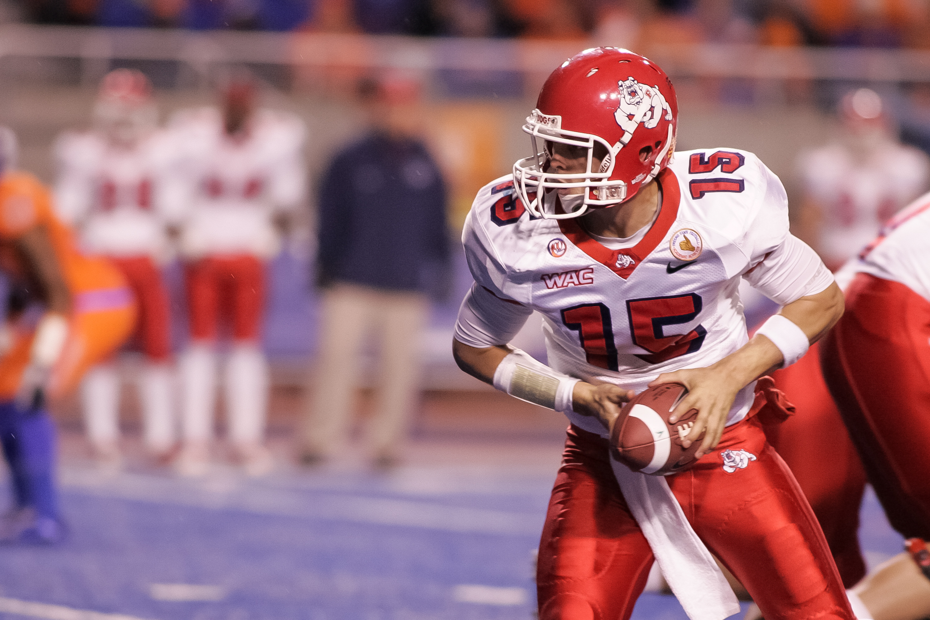 BOISE, ID - NOVEMBER 19: Ryan Colburn #15 of the Fresno State Bulldogs looks for the handoff against the Boise State Broncos at Bronco Stadium on November 19, 2010 in Boise, Idaho. (Photo by Otto Kitsinger III/Getty Images)