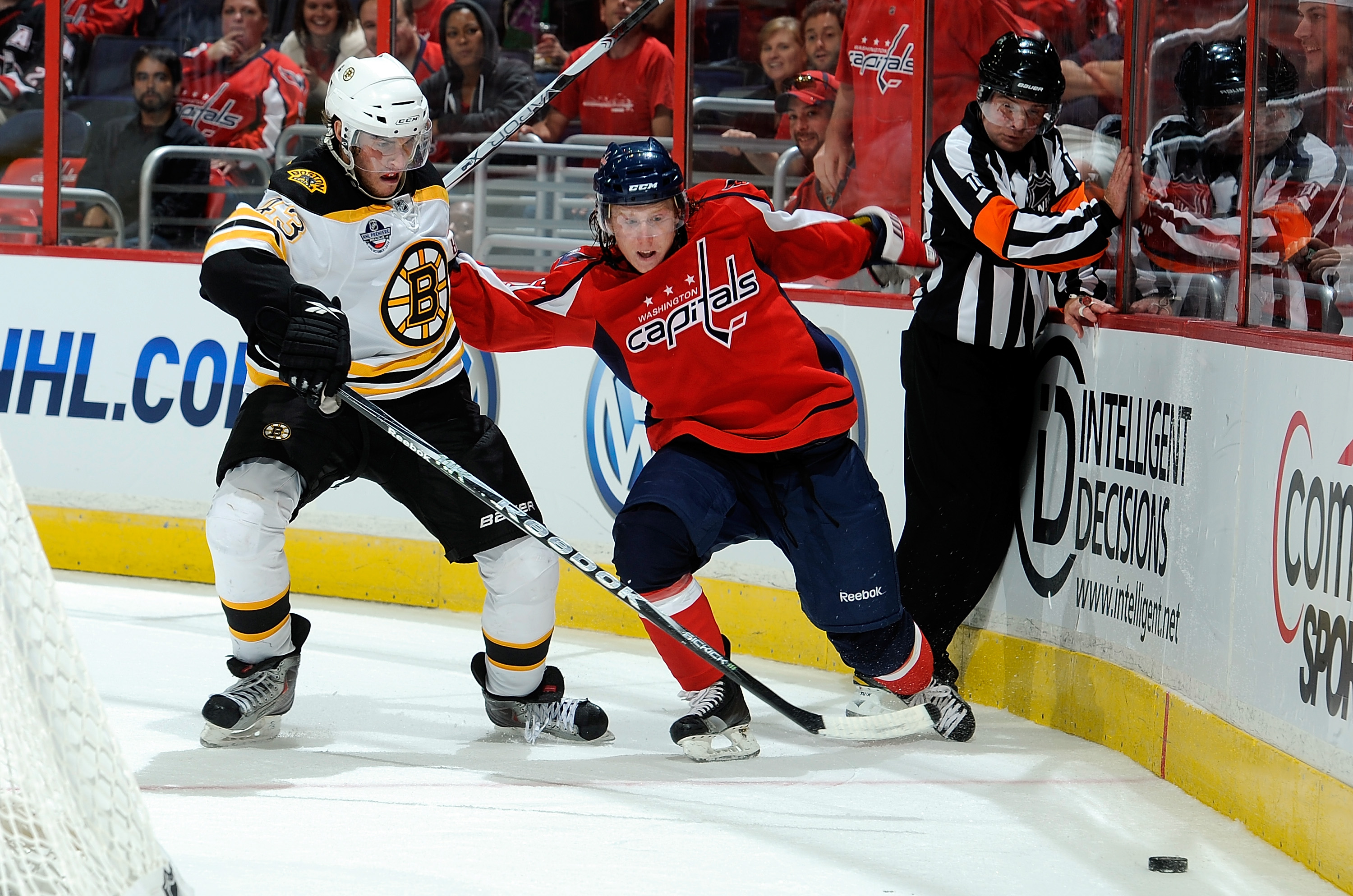 WASHINGTON - SEPTEMBER 28: Cody Eakin #50 of the Washington Capitals and Matt Bartkowski #43 of the Boston Bruins battle for the puck at Verizon Center on September 28, 2010 in Washington, DC. (Photo by Greg Fiume/Getty Images)