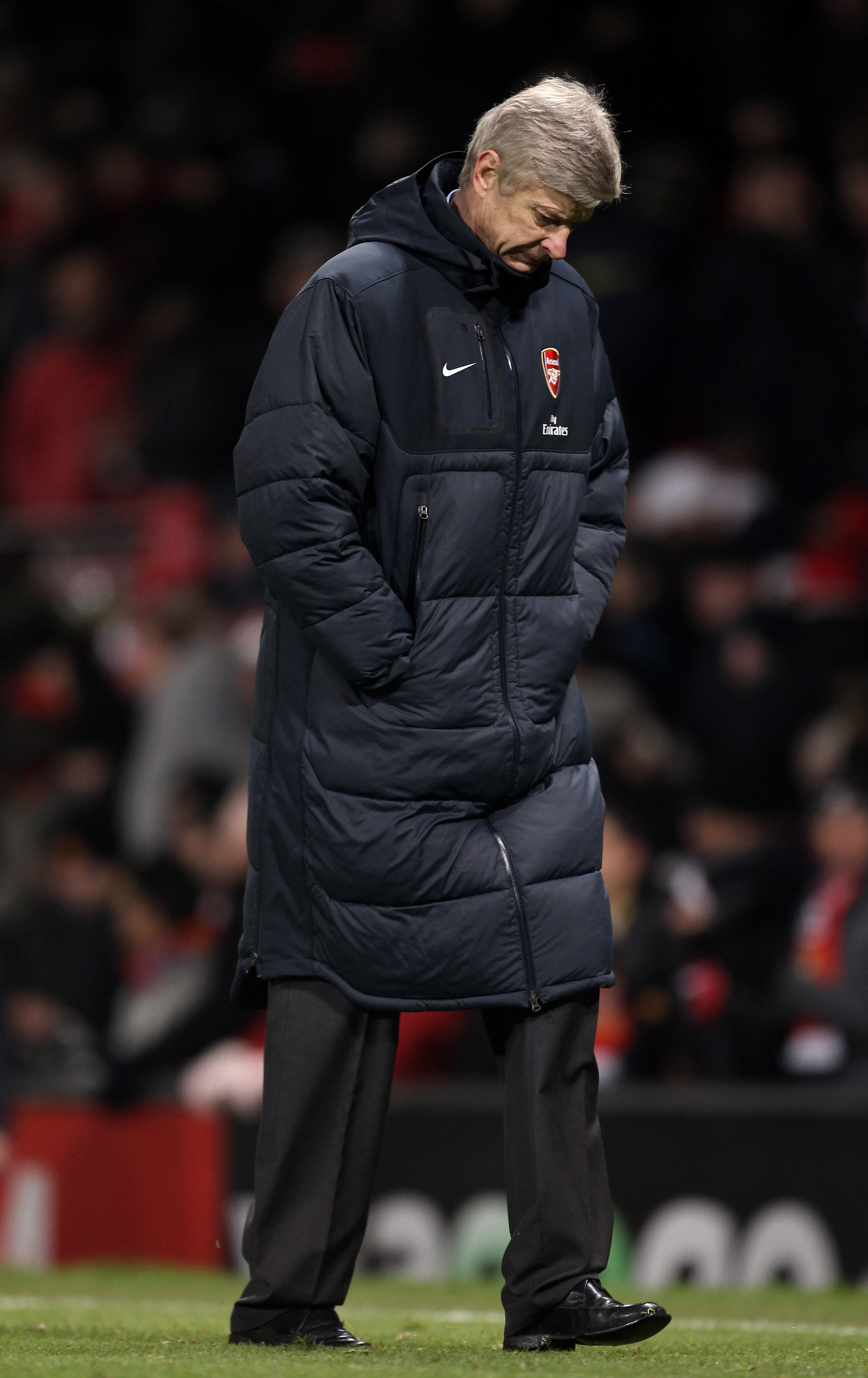 MANCHESTER, ENGLAND - DECEMBER 13:  Arsenal Manager Arsene Wenger heads for the dressing room at the end of the Barclays Premier League match between Manchester United and Arsenal at Old Trafford on December 13, 2010 in Manchester, England.  (Photo by Ale