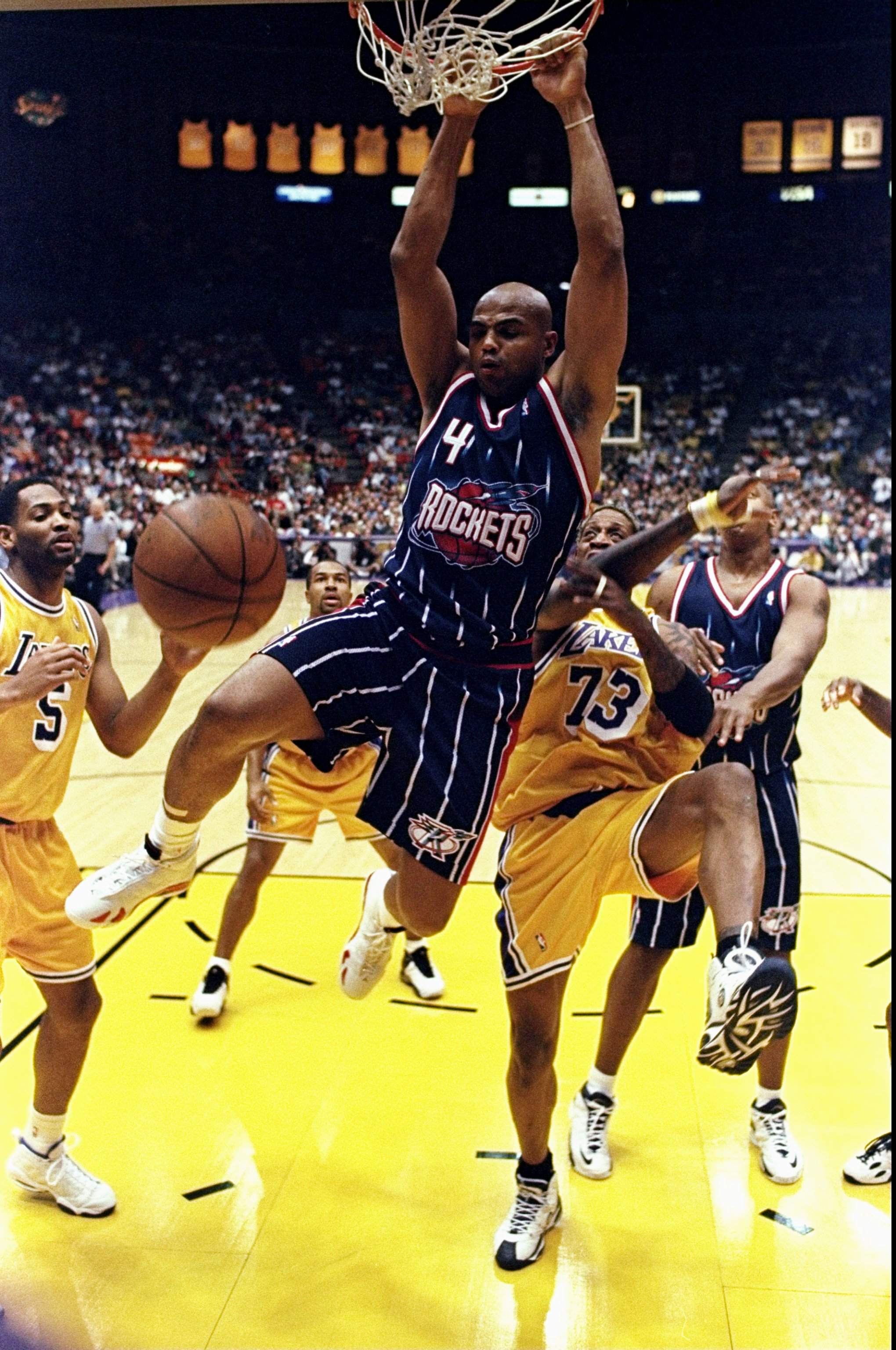 28 Feb 1999: Charles Barkley #4 of the Houston Rockets hangs from the hoop during the game against the Los Angeles Lakers at the Great Western Forum in Inglewood, California. The Lakers defeated the Rockets 106-90.    Mandatory Credit: Elsa Hasch  /Allspo