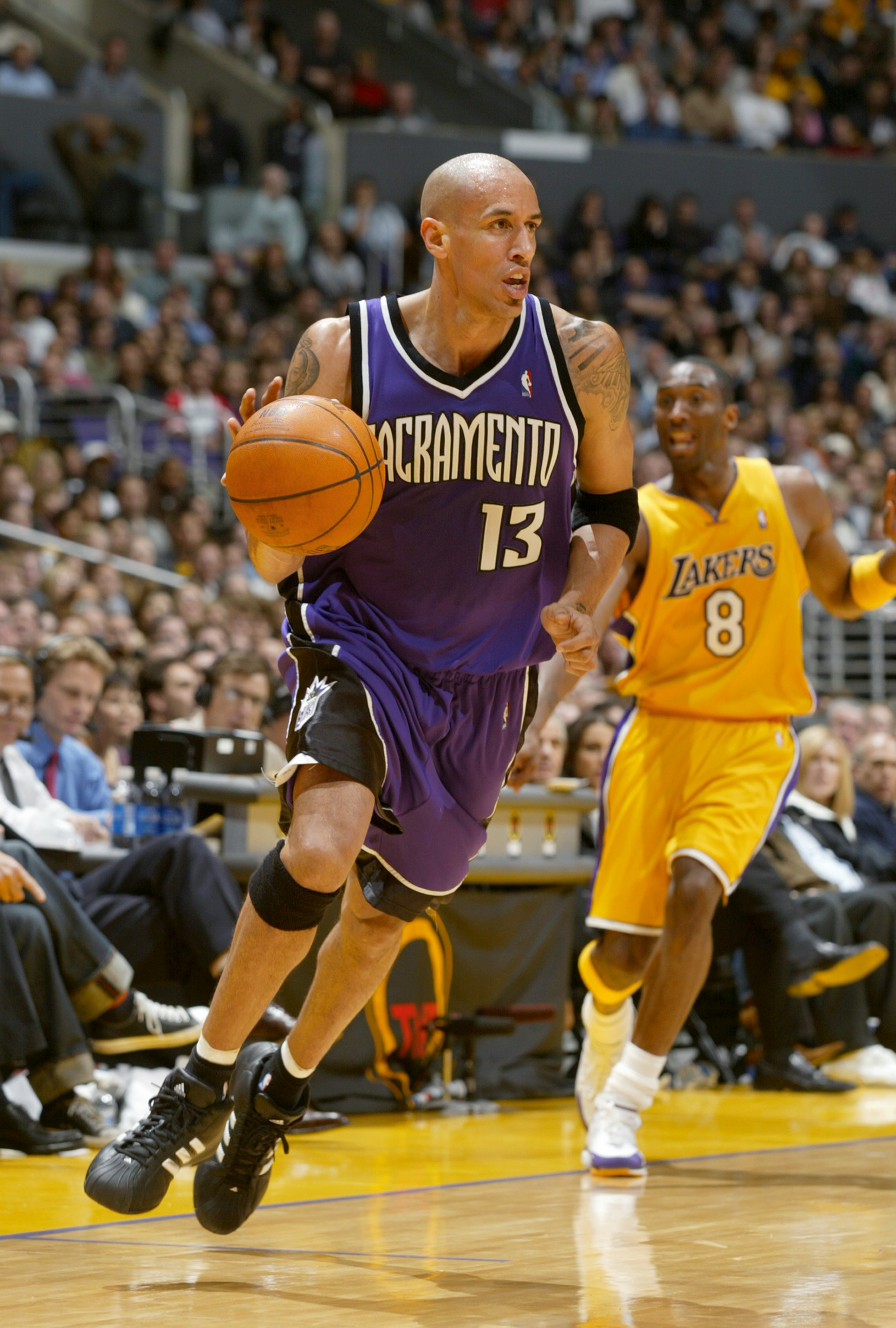 LOS ANGELES - FEBRUARY 26:  Doug Christie #13 of the Sacramento Kings drives during the game against the Los Angeles Lakers at Staples Center on February 26, 2004 in Los Angeles, California.  The Kings won 103-101.  NOTE TO USER: User expressly acknowledg