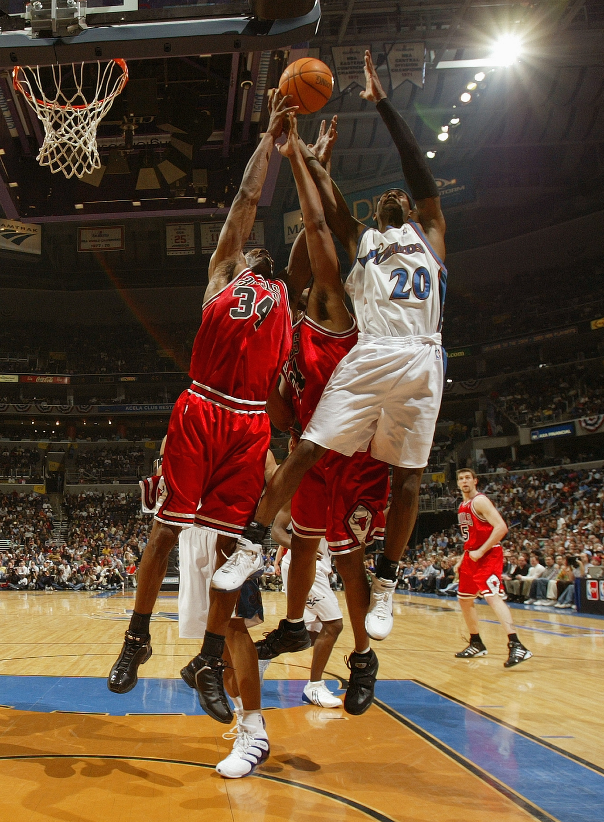 WAHINGTON - MAY 2:  Antonio Davis #34 of the Chicago Bulls rebounds against Larry Hughes #20 of the Washington Wizards in Game four of the Eastern Conference Quarterfinals during 2005 NBA Playoffs on May 2, 2005 at the MCI Center in Washington D.C. The Wi
