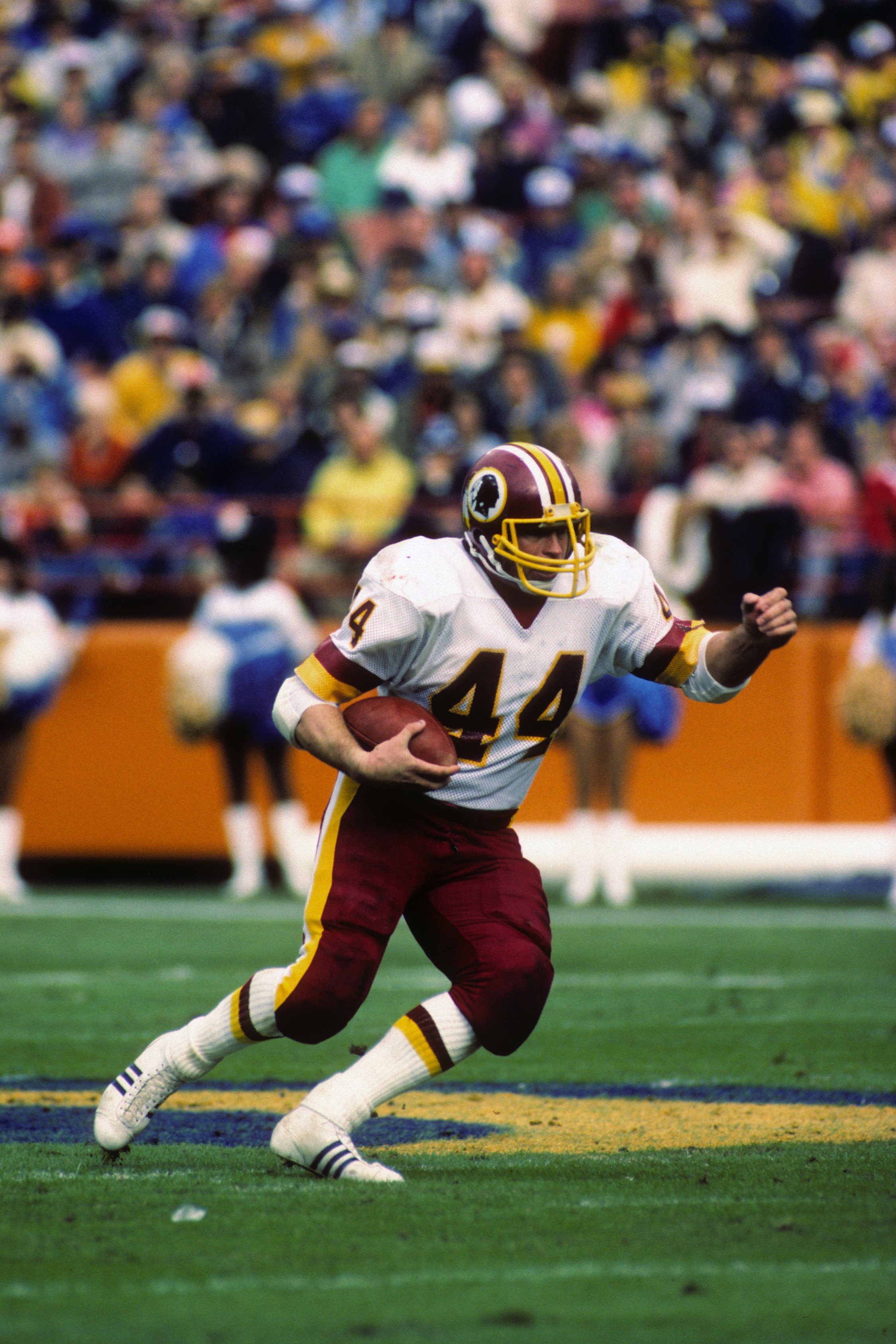 Washington Redskins running back John Riggins (44) hits a stone wall of  Atlanta Falcons as he attempts a run in the game between the Redskins and  the Atlanta Falcons in Washington, Aug.